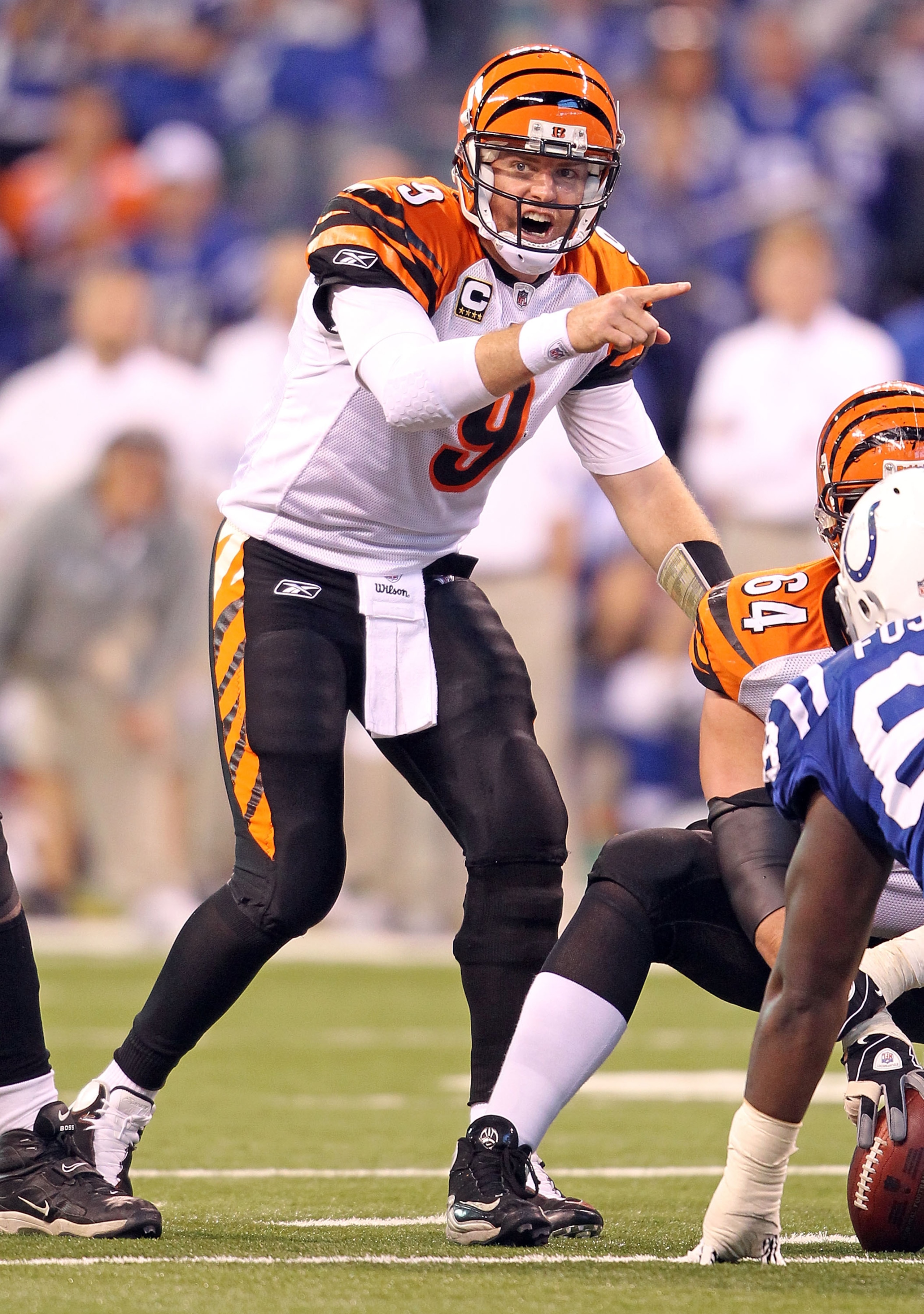 INDIANAPOLIS - NOVEMBER 14:  Carson Palmer #9 of the Cincinnati Bengals gives instructions to his team during the Bengals 23-17 loss to the Indianapolis Colts in the NFL game at Lucas Oil Stadium on November 14, 2010 in Indianapolis, Indiana. (Photo by An