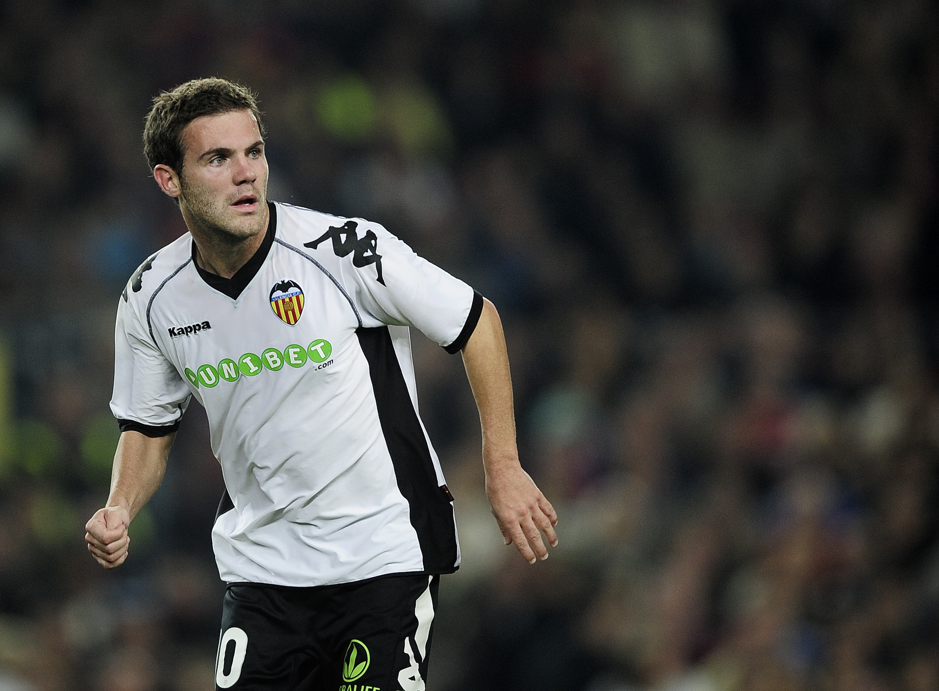 BARCELONA, SPAIN - OCTOBER 16: Juan Mata of Valencia looks on during the La Liga match between Barcelona and Valencia at the Camp Nou stadium on October 16, 2010 in Barcelona, Spain. Barcelona won the match 2-1. (Photo by David Ramos/Getty Images)