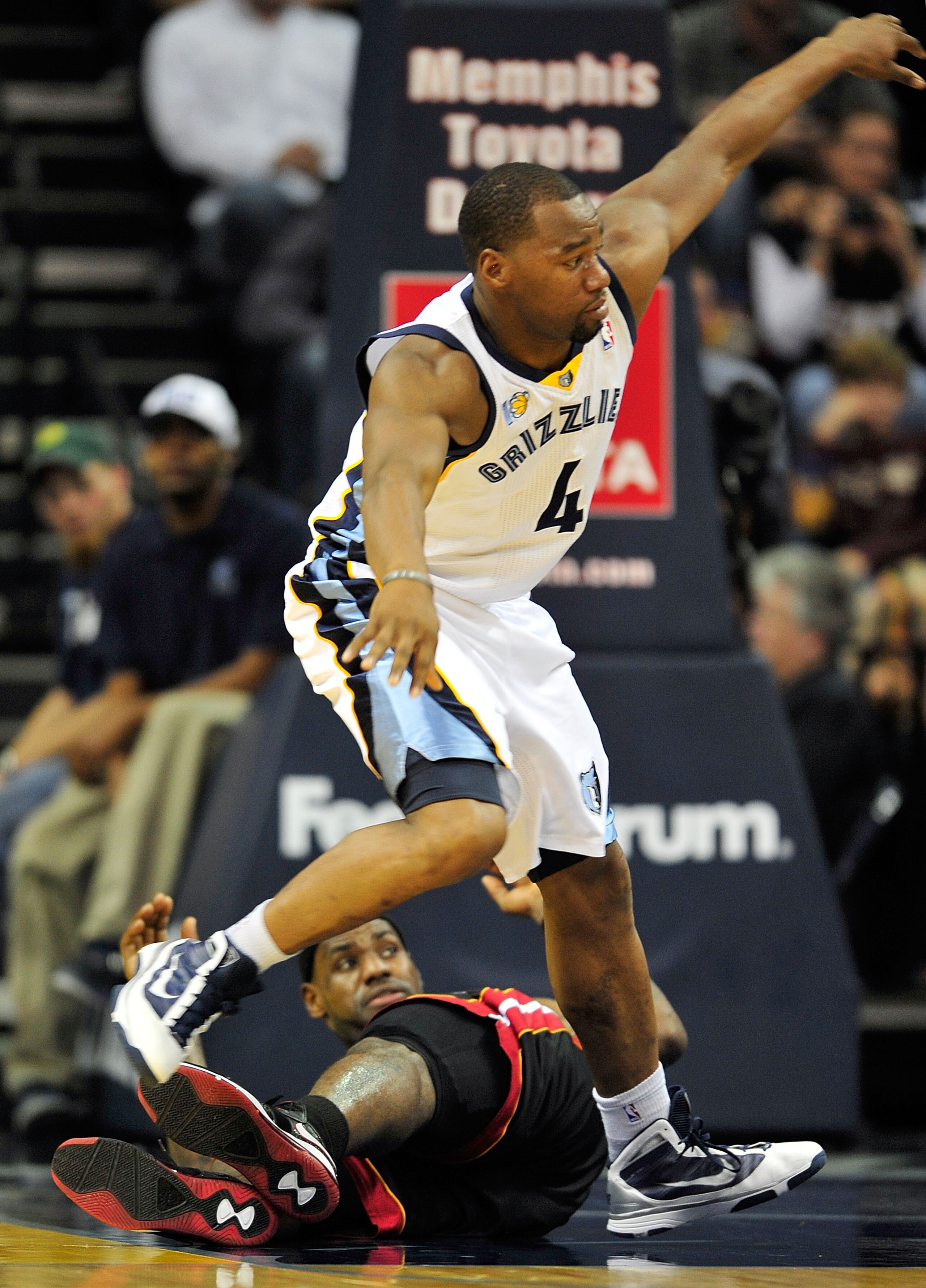 MEMPHIS, TN - NOVEMBER 20: Sam Young #4 of the Memphis Grizzlies hurdles LeBron James #6 of the Miami Heat as he chases a loose ball at FedExForum on November 20, 2010 in Memphis, Tennessee. The Grizzlies won 97-95. NOTE TO USER: User expressly acknowl MEMPHIS, TN - NOVEMBER 20: Sam Young #4 of the Memphis Grizzlies hurdles LeBron James #6 of the Miami Heat as he chases a loose ball at FedExForum on November 20, 2010 in Memphis, Tennessee. The Grizzlies won 97-95. NOTE TO USER: User expressly acknowl