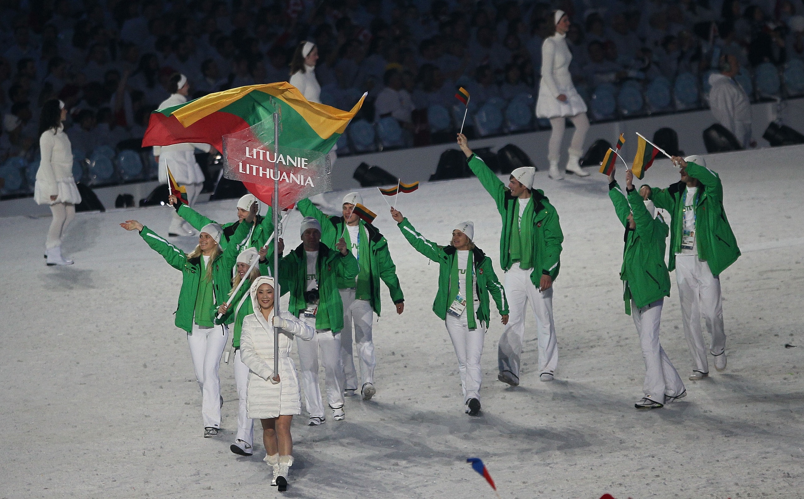 VANCOUVER, BC - FEBRUARY 12:  Irina Terentjeva of Lithuania carries the flag during the Opening Ceremony of the 2010 Vancouver Winter Olympics at BC Place on February 12, 2010 in Vancouver, Canada.  (Photo by Bruce Bennett/Getty Images)