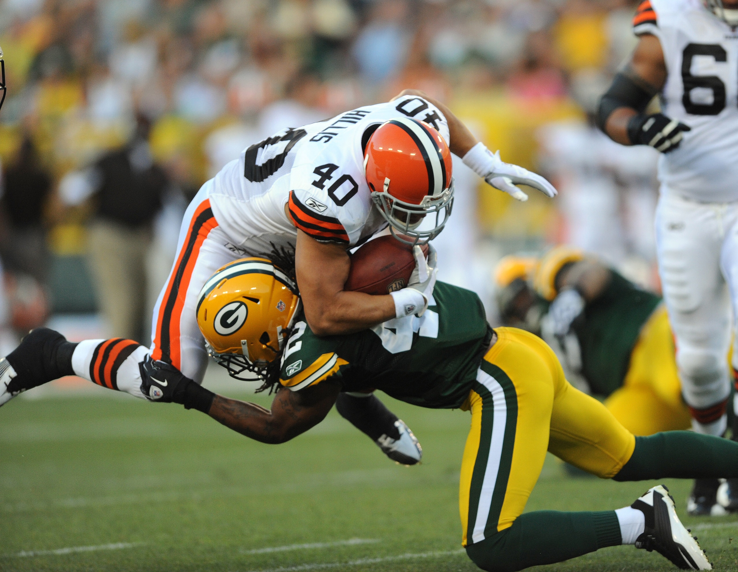 GREEN BAY - AUGUST 14: Peyton Hillis #40 of the Cleveland Browns is tackled by Morgan Burnett #42 of the Green Bay Packers during the NFL preseason game at Lambeau Field August 14, 2010 in Green Bay, Wisconsin.  (Photo by Tom Dahlin/Getty Images)