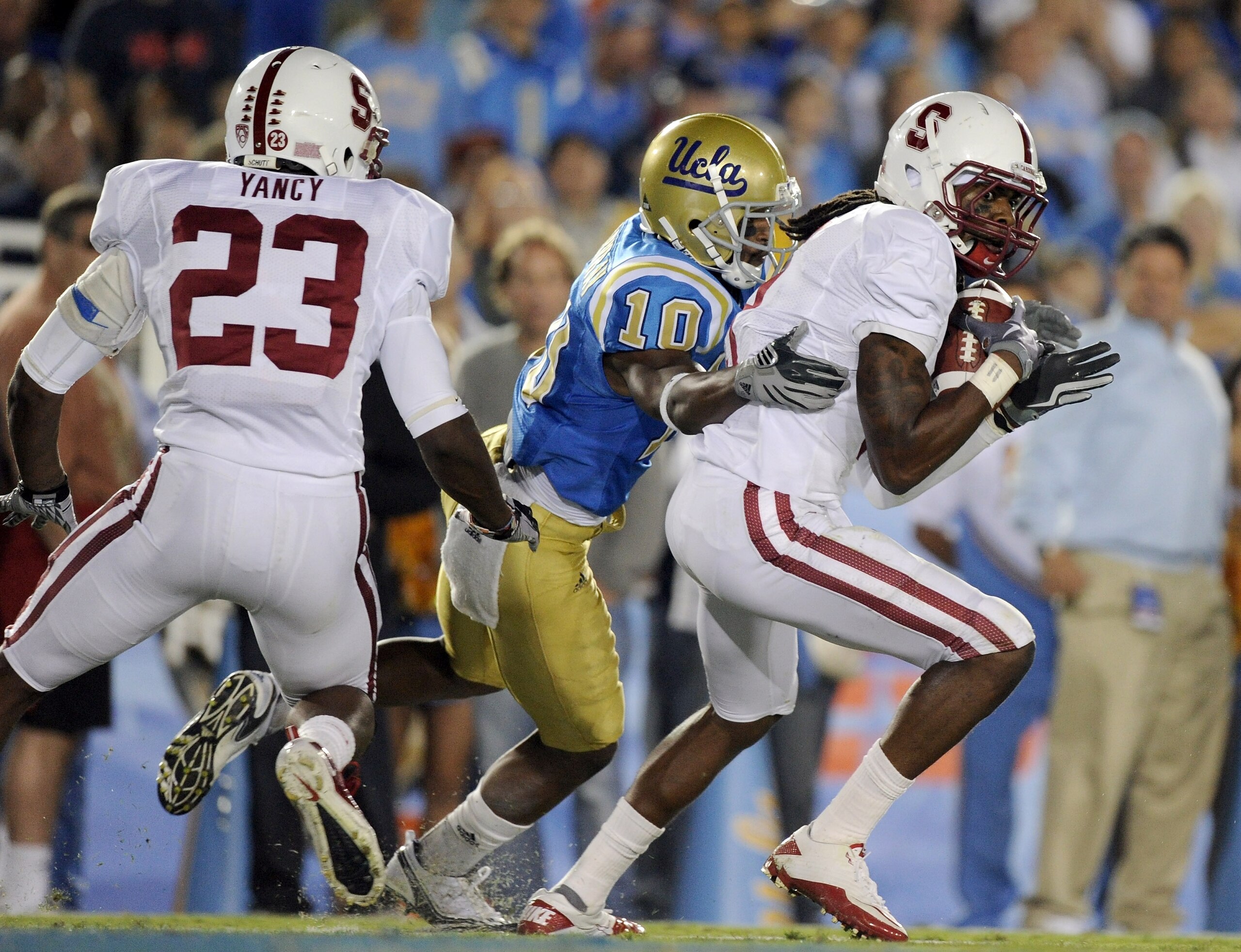 PASADENA, CA - SEPTEMBER 11: Richard Sherman #9 of Stanford makes an interception in front of Ricky Marvray #10 of UCLA and Austin Yancy #23 of Stanford during the second quarter at Rose Bowl on September 11, 2010 in Pasadena, California. (Photo by Harr PASADENA, CA - SEPTEMBER 11: Richard Sherman #9 of Stanford makes an interception in front of Ricky Marvray #10 of UCLA and Austin Yancy #23 of Stanford during the second quarter at Rose Bowl on September 11, 2010 in Pasadena, California. (Photo by Harr