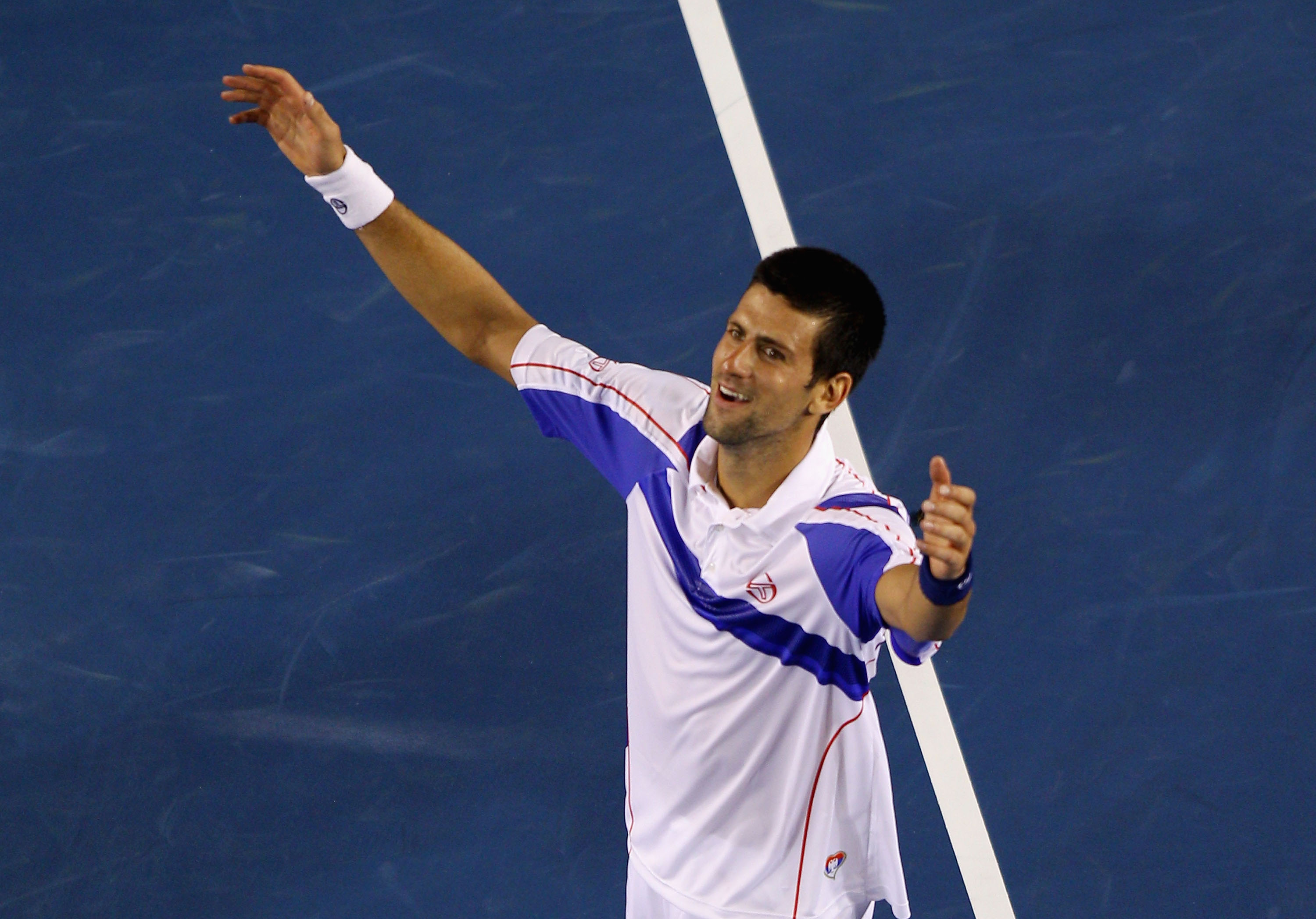MELBOURNE, AUSTRALIA - JANUARY 30:  Novak Djokovic of Serbia celebrates in his men's final match against Andy Murray of Great Britain during day fourteen of the 2011 Australian Open at Melbourne Park on January 30, 2011 in Melbourne, Australia.  (Photo by