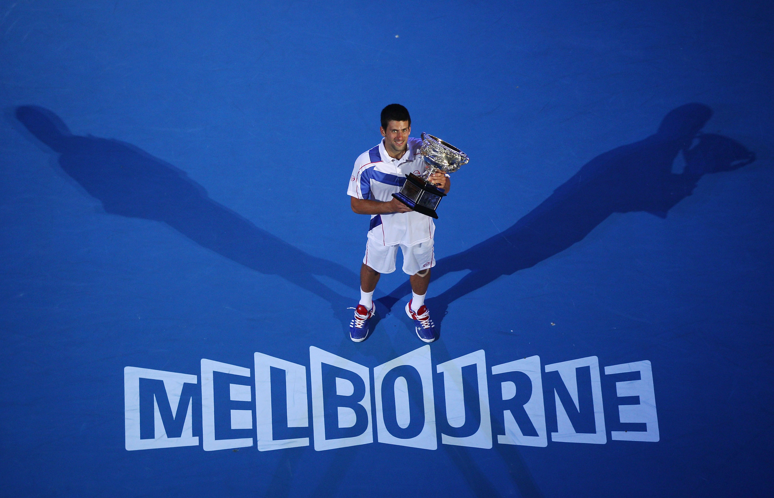 MELBOURNE, AUSTRALIA - JANUARY 30:  Novak Djokovic of Serbia holds the Norman Brookes Challenge Cup after winning his men's final match against Andy Murray of Great Britain during day fourteen of the 2011 Australian Open at Melbourne Park on January 30, 2