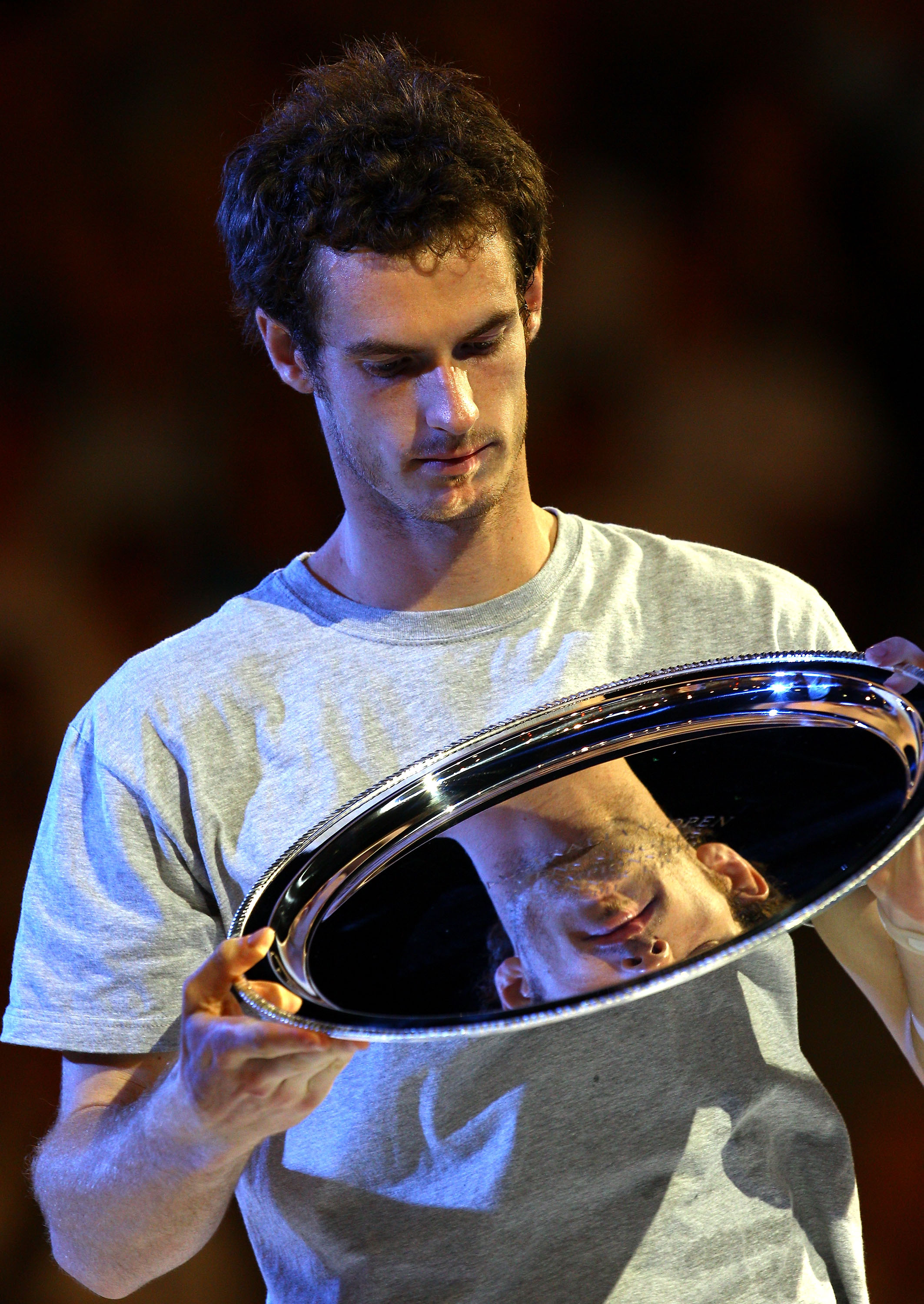 MELBOURNE, AUSTRALIA - JANUARY 30:  Andy Murray of Great Britain poses with the runners up trophy after losing his men's final match against Novak Djokovic of Serbia during day fourteen of the 2011 Australian Open at Melbourne Park on January 30, 2011 in