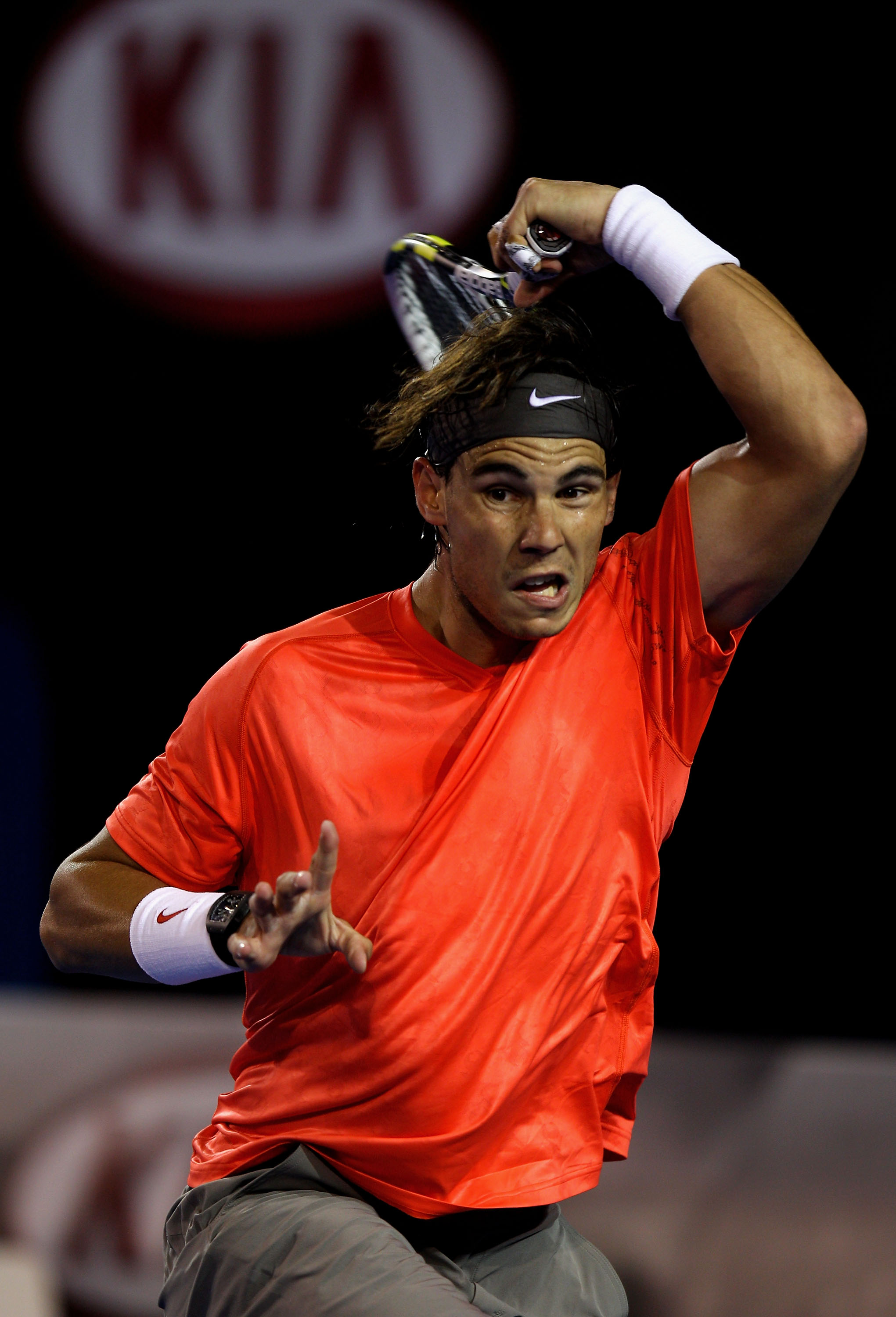 MELBOURNE, AUSTRALIA - JANUARY 24:  Rafael Nadal of Spain plays a forehand in his fourth round match against Marin Cilic of Croatia during day eight of the 2011 Australian Open at Melbourne Park on January 24, 2011 in Melbourne, Australia.  (Photo by Mark