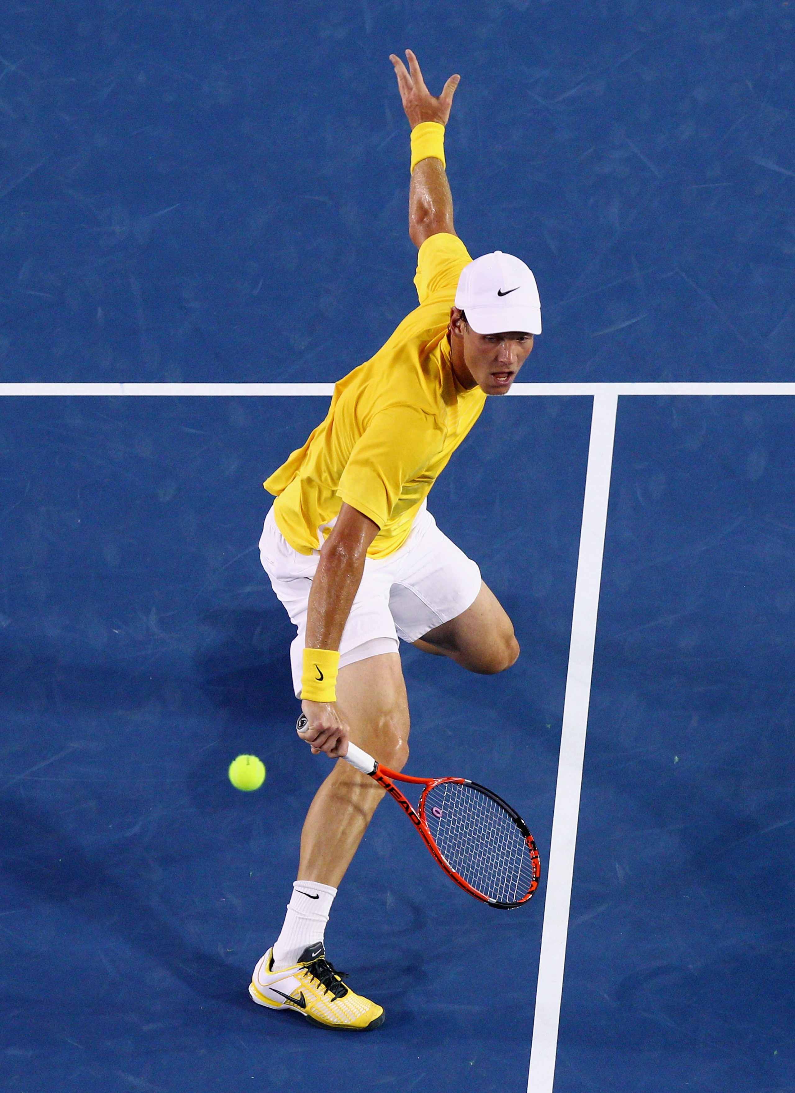 MELBOURNE, AUSTRALIA - JANUARY 25:  Tomas Berdych of the Czech Republic plays a backhand in his quarterfinal match against Novak Djokovic of Serbia during day nine of the 2011 Australian Open at Melbourne Park on January 25, 2011 in Melbourne, Australia.