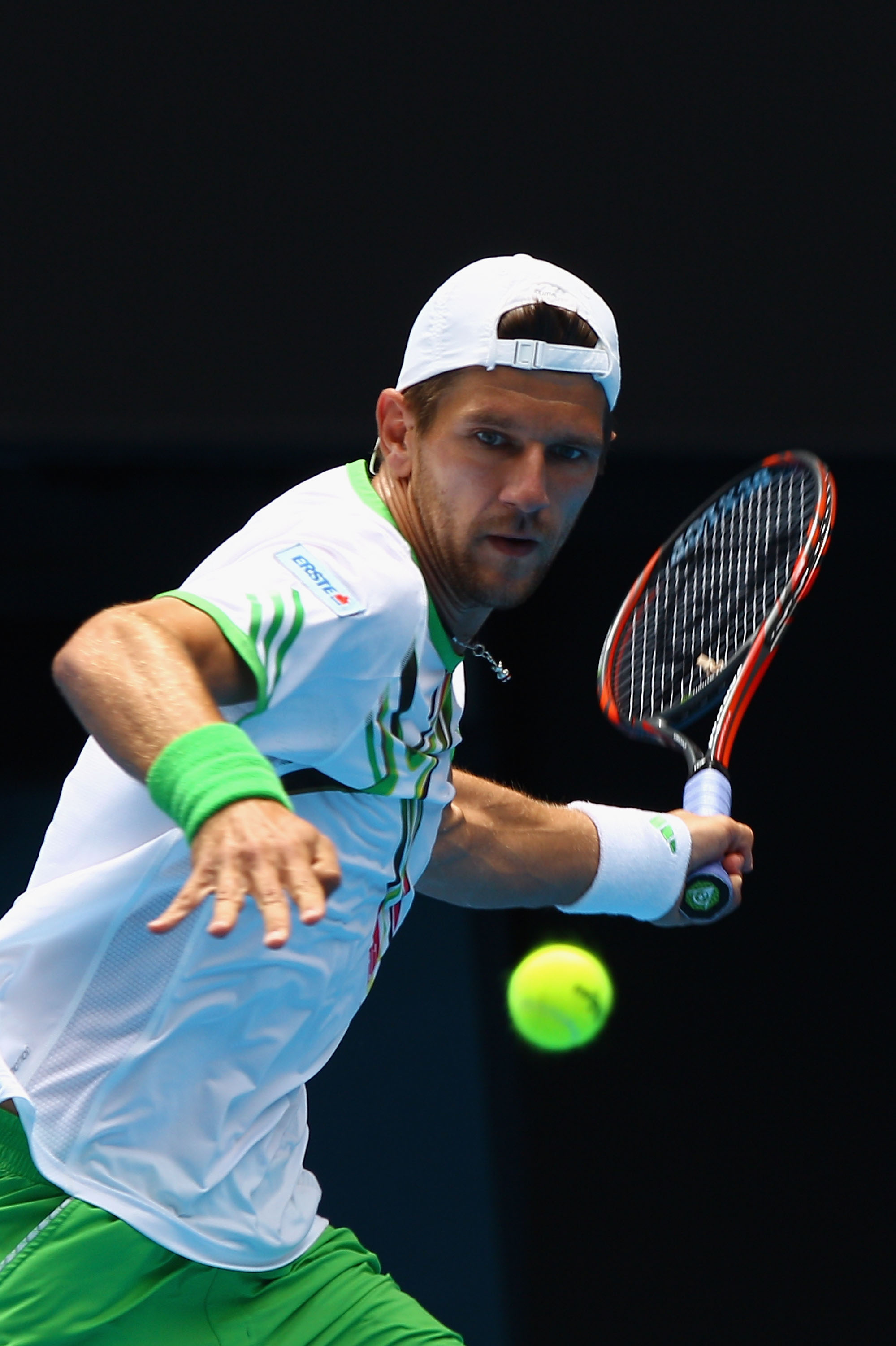MELBOURNE, AUSTRALIA - JANUARY 24:  Jurgen Melzer of Austria plays a backhand in his fourth round match against during day eight of the 2011 Australian Open at Melbourne Park on January 24, 2011 in Melbourne, Australia.  (Photo by Quinn Rooney/Getty Image