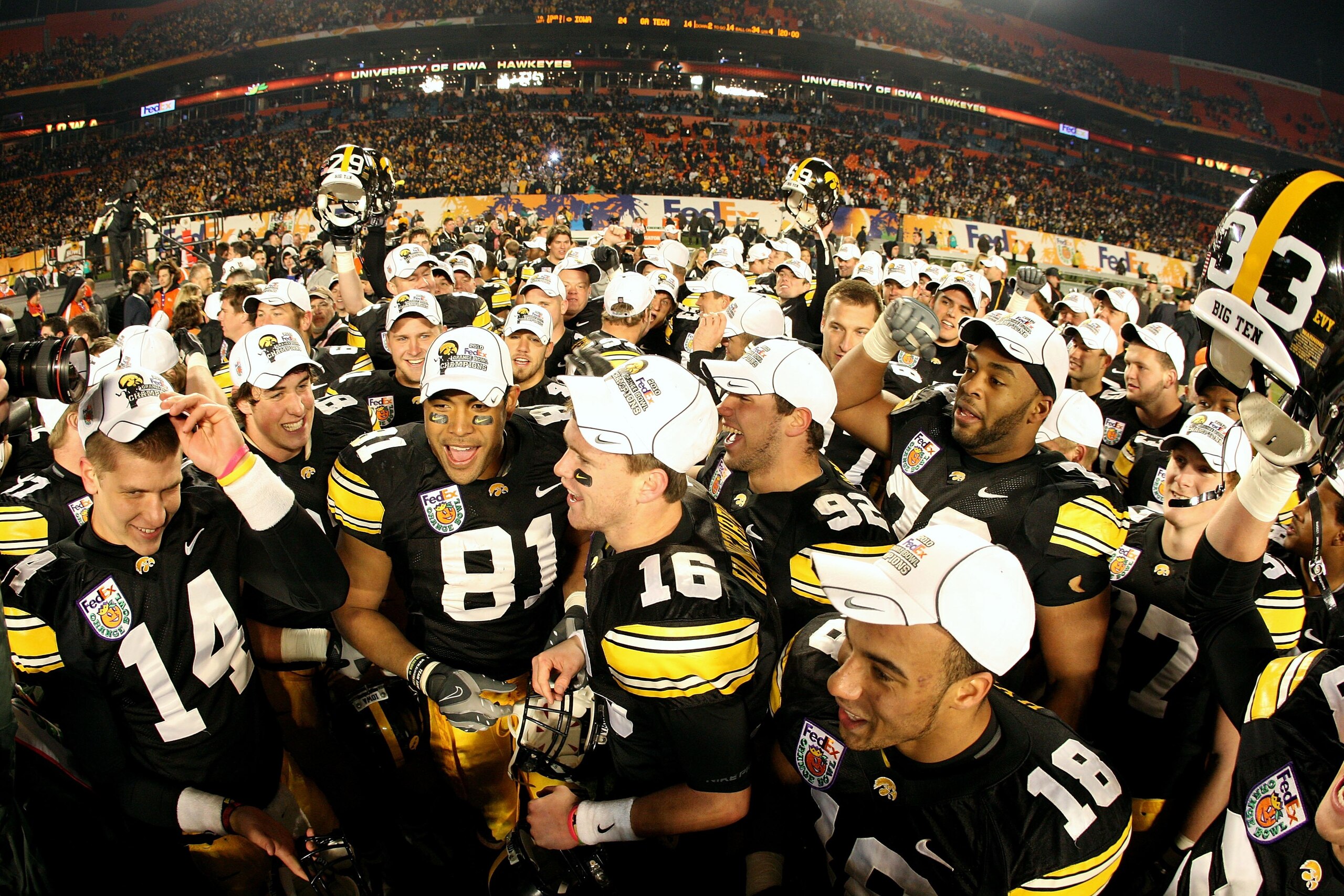 MIAMI GARDENS, FL - JANUARY 05:  Tony Moeaki #81 of the Iowa Hawkeyes celebrates with his teammates after Iowa won 24-14 against the Georgia Tech Yellow Jackets during the FedEx Orange Bowl at Land Shark Stadium on January 5, 2010 in Miami Gardens, Florid