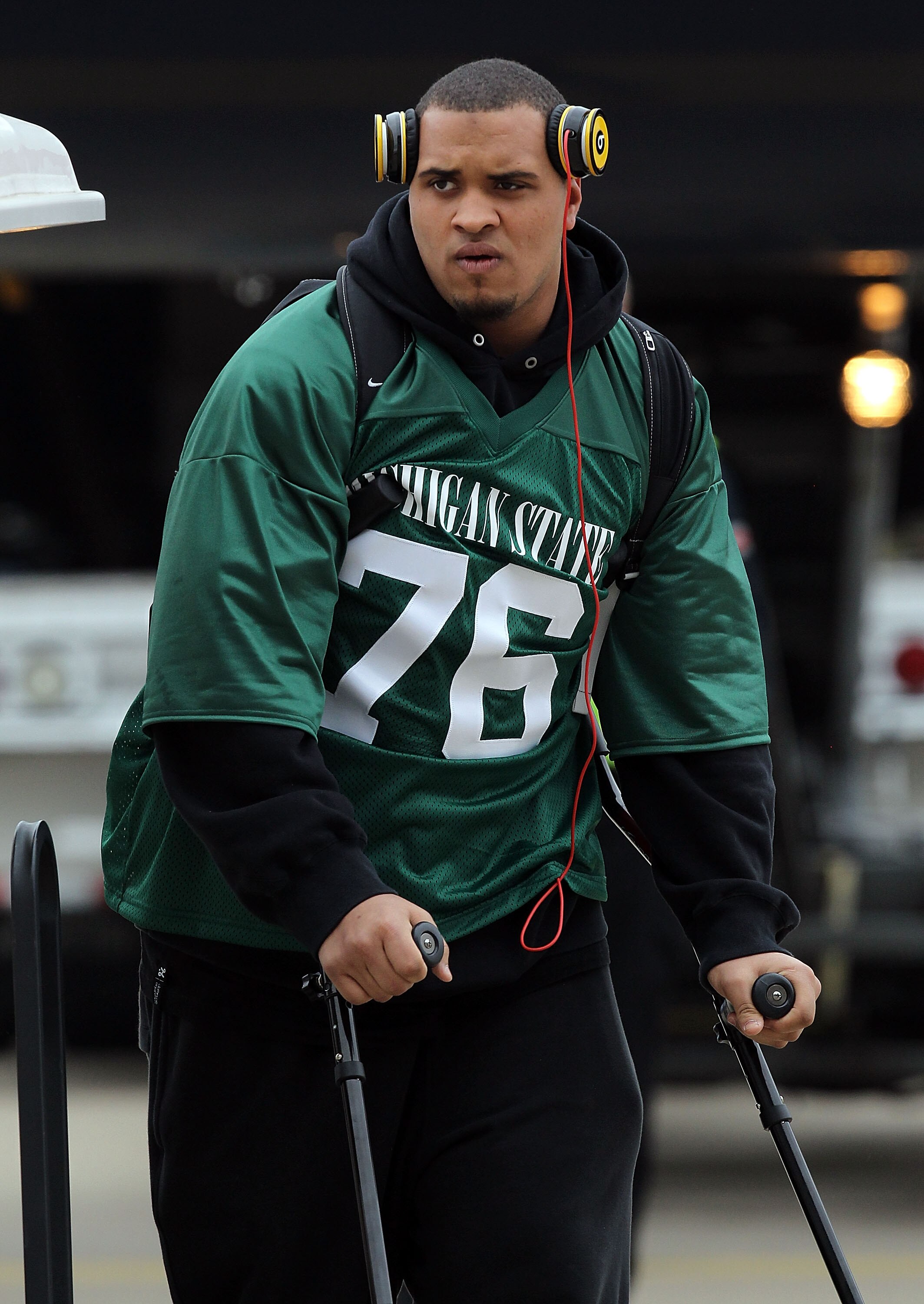 DALLAS, TX - JANUARY 31:  Maurkice Pouncey #53 of the Pittsburgh Steelers wears the Michigan State jersey of teammate Flozell Adams while arriving at Dallas Fort Worth International Airport on January 31, 2011 in Dallas, Texas.  The Pittsburgh Steelers wi