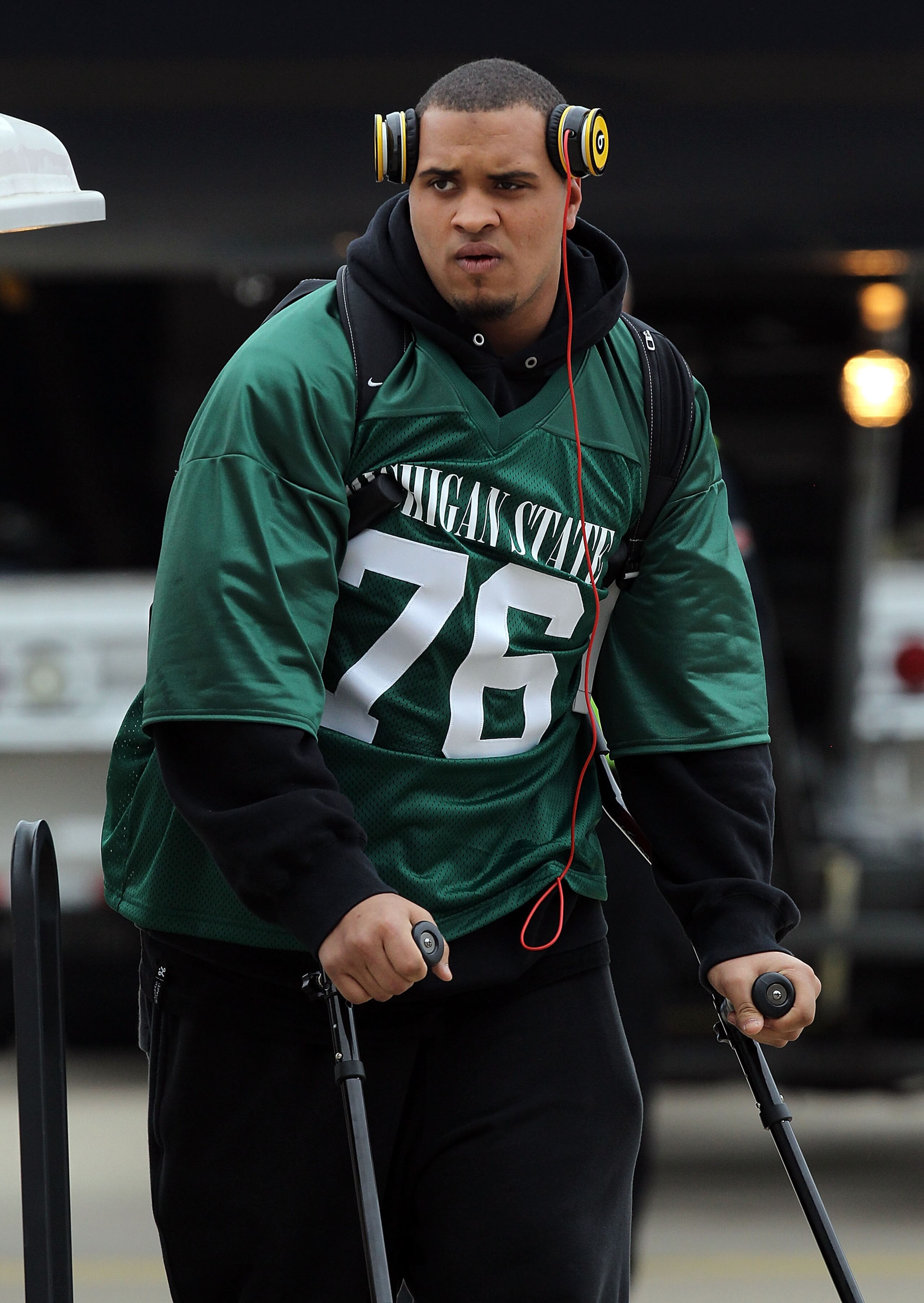 DALLAS, TX - JANUARY 31:  Maurkice Pouncey #53 of the Pittsburgh Steelers wears the Michigan State jersey of teammate Flozell Adams while arriving at Dallas Fort Worth International Airport on January 31, 2011 in Dallas, Texas.  The Pittsburgh Steelers wi