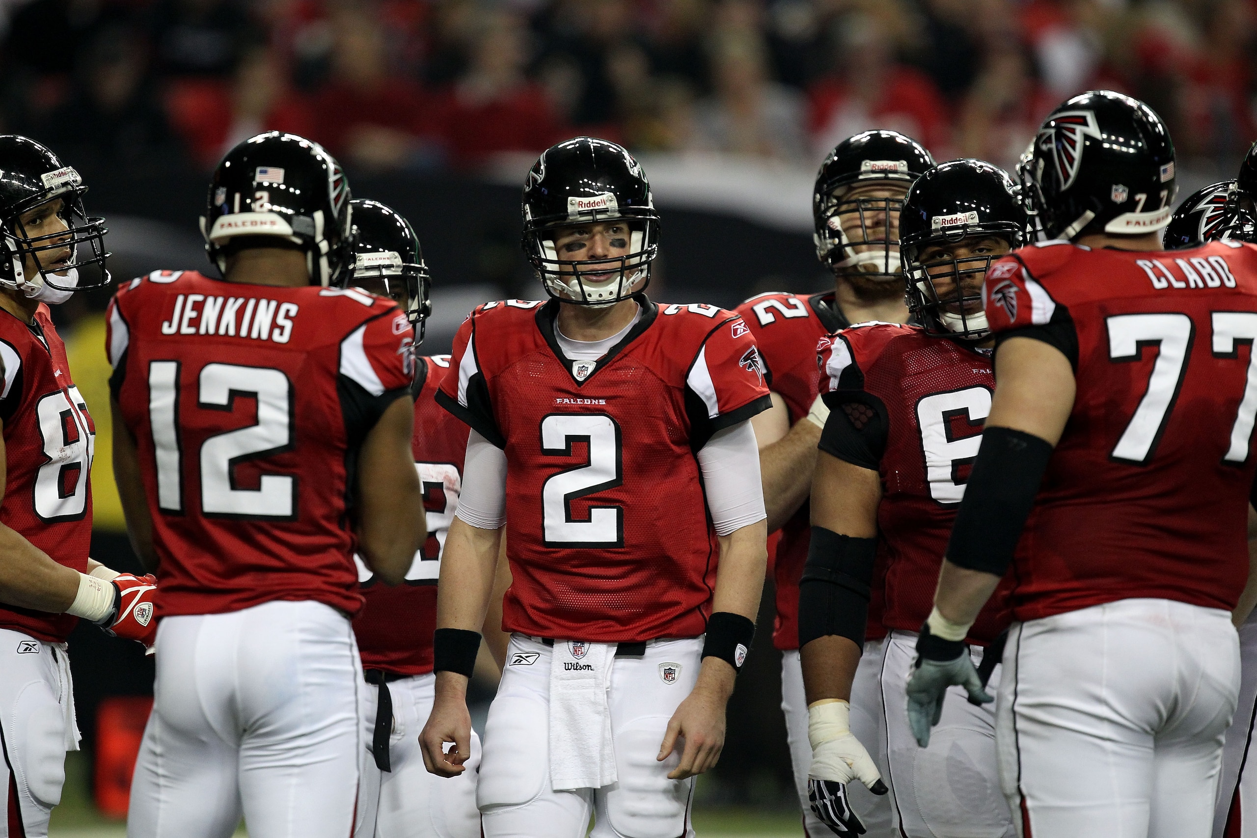 ATLANTA, GA - JANUARY 15:  Matt Ryan #2 of the Atlanta Falcons looks on as he stands in the huddle with his teammates against the Green Bay Packers during their 2011 NFC divisional playoff game at Georgia Dome on January 15, 2011 in Atlanta, Georgia.  (Ph