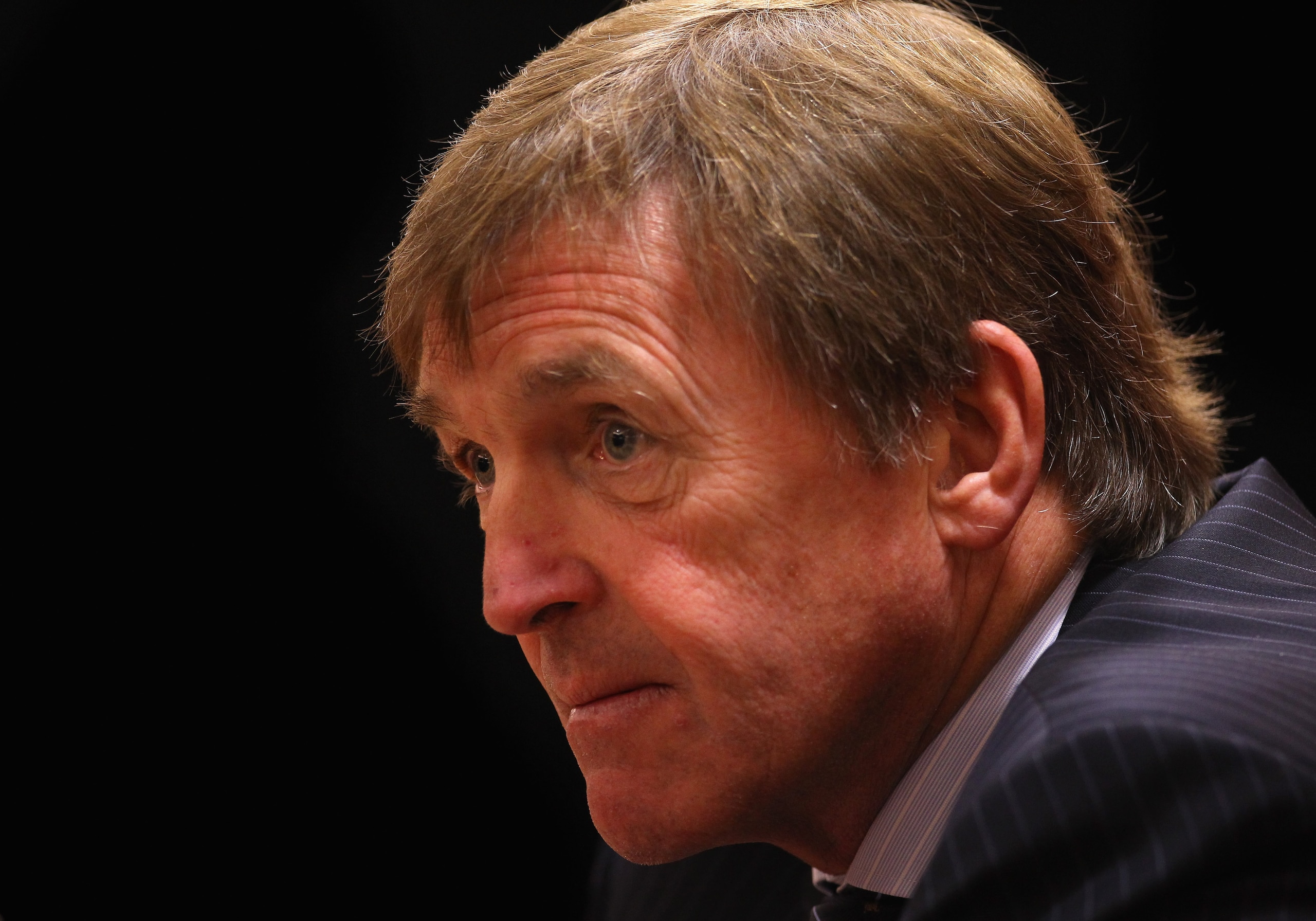 LIVERPOOL, ENGLAND - FEBRUARY 03:  Kenny Dalglish the manager of Liverpool faces the media during a press conference to introduce his new signings, Luis Suarez and Andy Carroll, at Anfield on February 3, 2011 in Liverpool, England.  (Photo by Alex Livesey