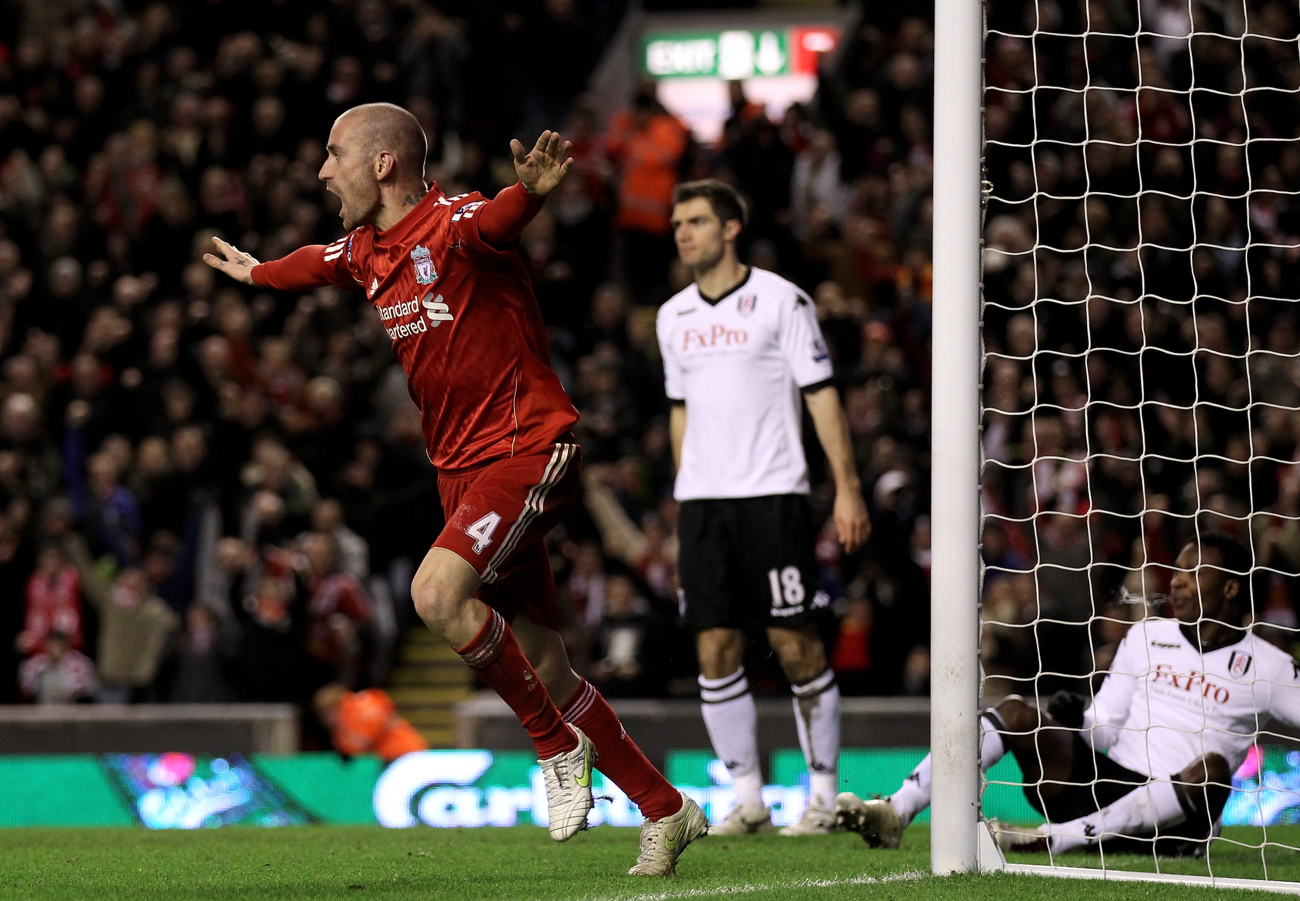 LIVERPOOL, ENGLAND - JANUARY 26:  Raul Meireles of Liverpool celebrates after John Pantsil of Fulham scored an own goal during the Barclays Premier League match between Liverpool and Fulham at Anfield on January 26, 2011 in Liverpool, England.  (Photo by
