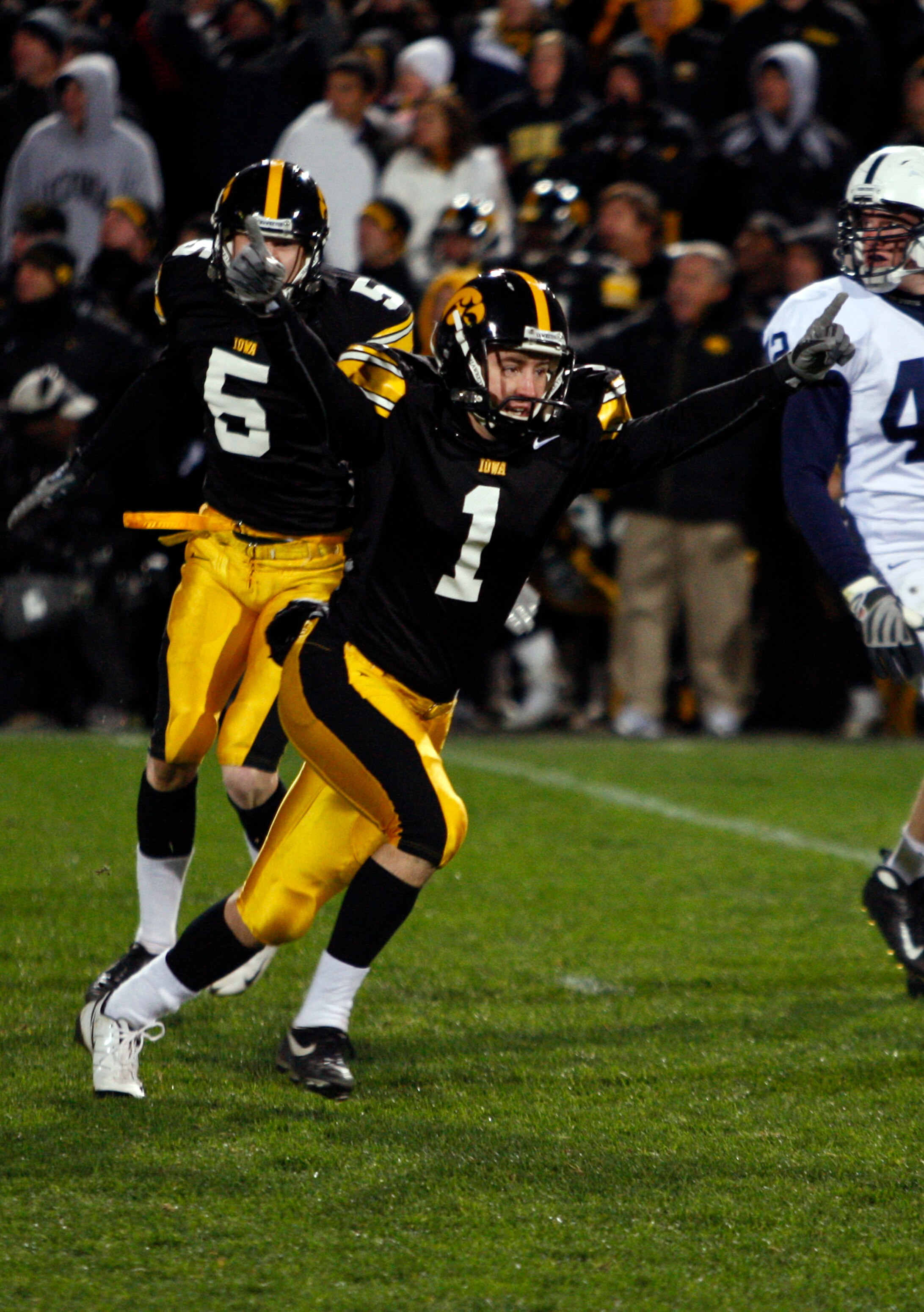 IOWA CITY, IA - NOVEMBER 8:  Iowa Kicker Daniel Murray #1 celebrates with teammate Ryan Donahue #5 after kicking the game winning field goal defeating Penn State Nittany Lions with six seconds left on the clock at Kinnick Stadium on November 8, 2008 in Io