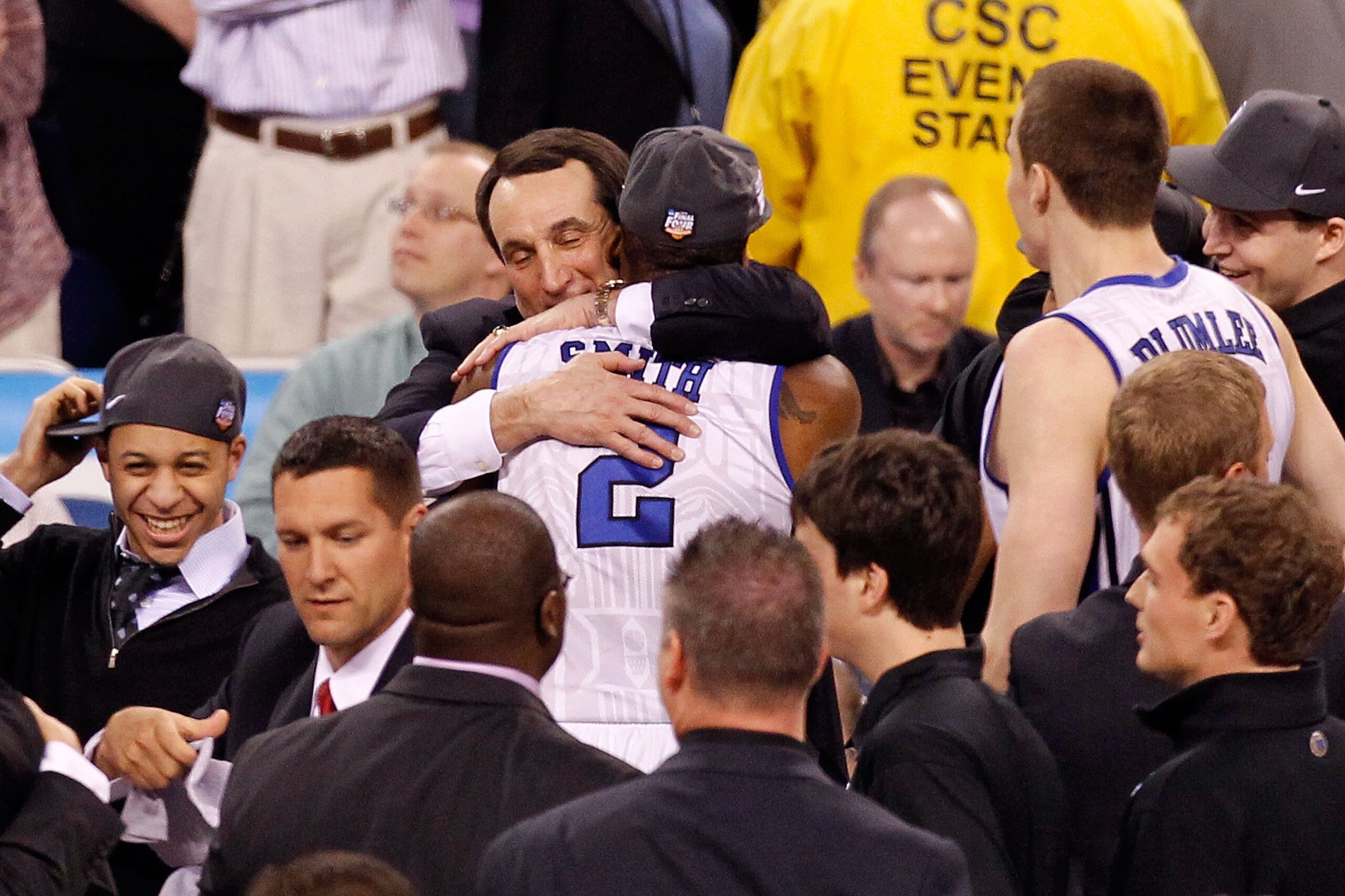 INDIANAPOLIS - APRIL 05:  Head coach Mike Krzyzewski of the Duke Blue Devils hugs Nolan Smith #2 following Duke's 61-59 win against the Butler Bulldogs during the 2010 NCAA Division I Men's Basketball National Championship game at Lucas Oil Stadium on Apr