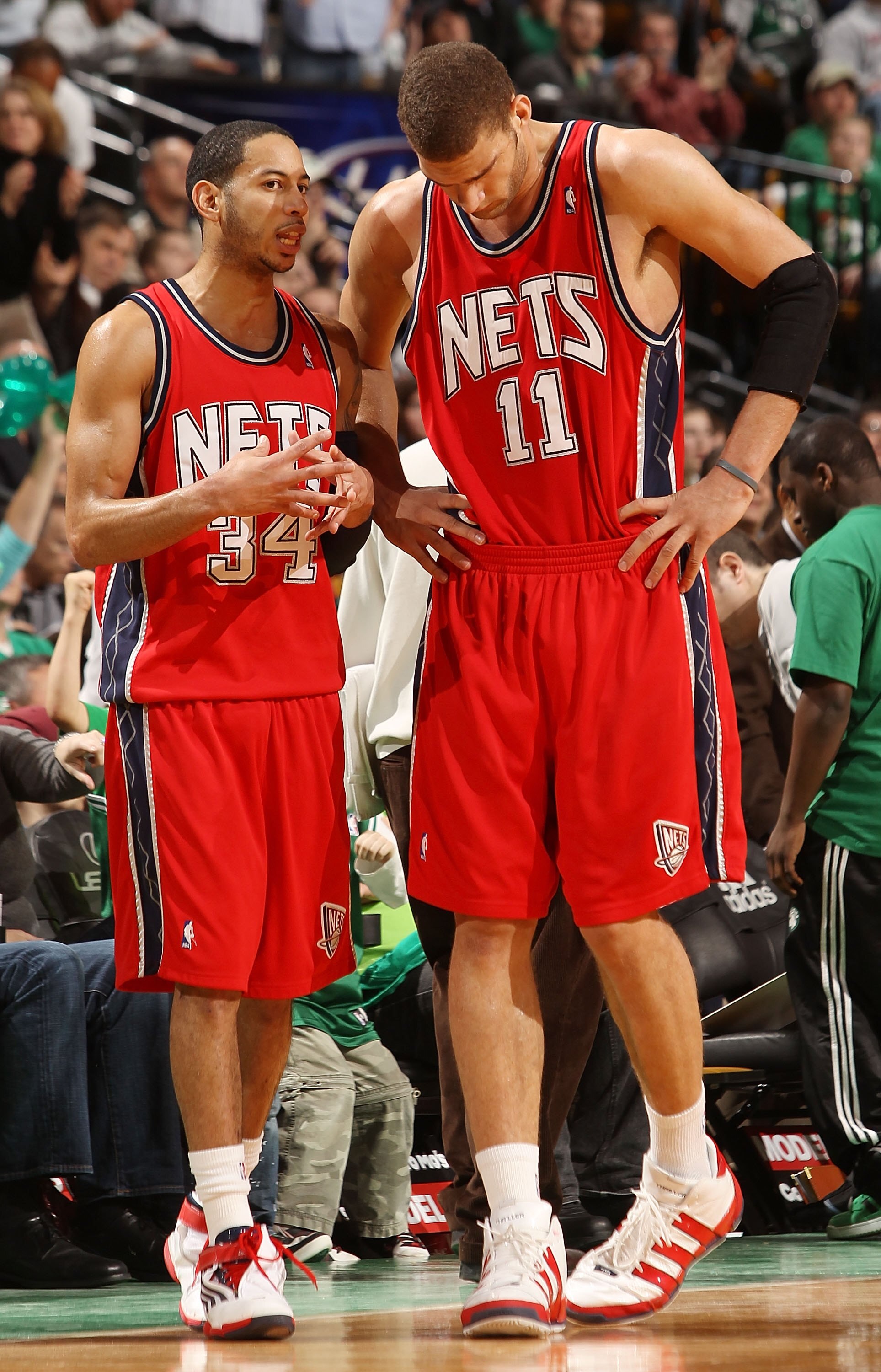 BOSTON - FEBRUARY 27:  Devin Harris #34 of the New Jersey Nets talks with Brook Lopez #11 during a time out against the Boston Celtics at the TD Garden on February 27, 2010 in Boston, Massachusetts. The Nets defeated the Celtics 104-96.  NOTE TO USER: Use