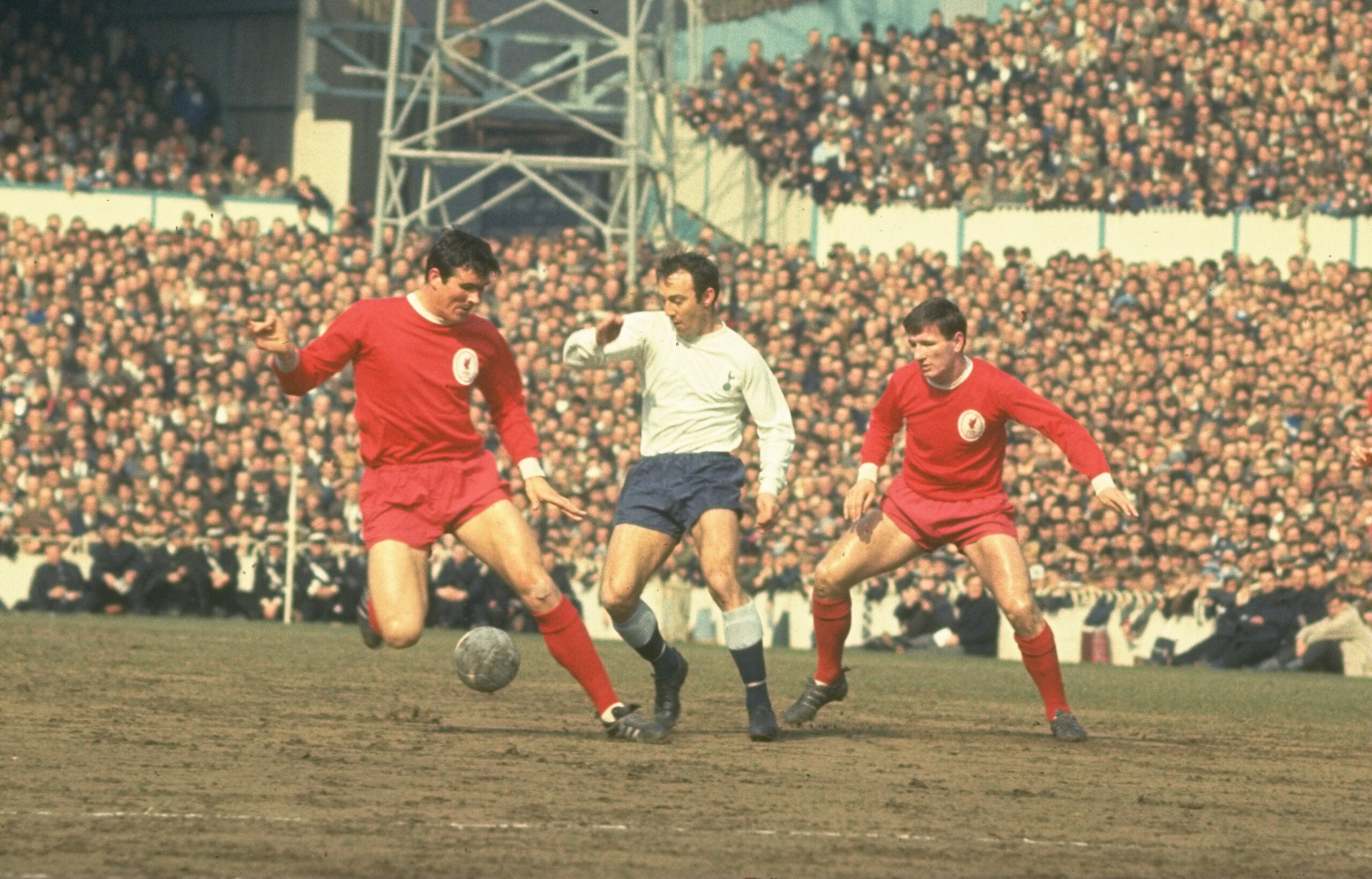 1965:  Jimmy Greaves (centre) of Tottenham Hotspur sneaks in between Ron Yeats (left) and Tommy Smith (right) of Liverpool during the match between Spurs and Liverpool at White Hart Lane, London.   \ Mandatory Credit: Allsport UK /Allsport