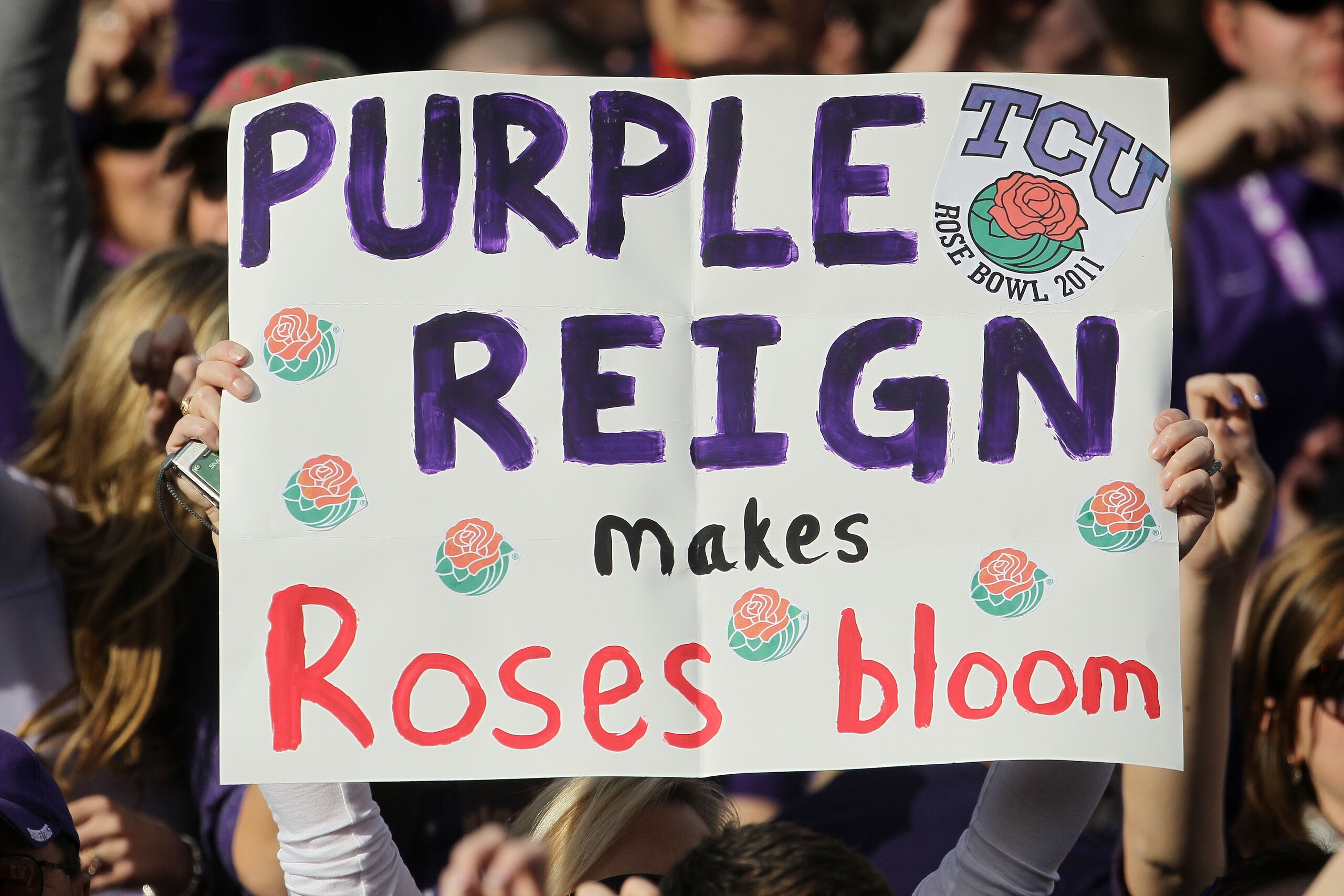 PASADENA, CA - JANUARY 01:  A fan of the TCU Horned Frogs holds a sign during the 97th Rose Bowl game against the Wisconsin Badgers on January 1, 2011 in Pasadena, California.  (Photo by Jeff Gross/Getty Images)