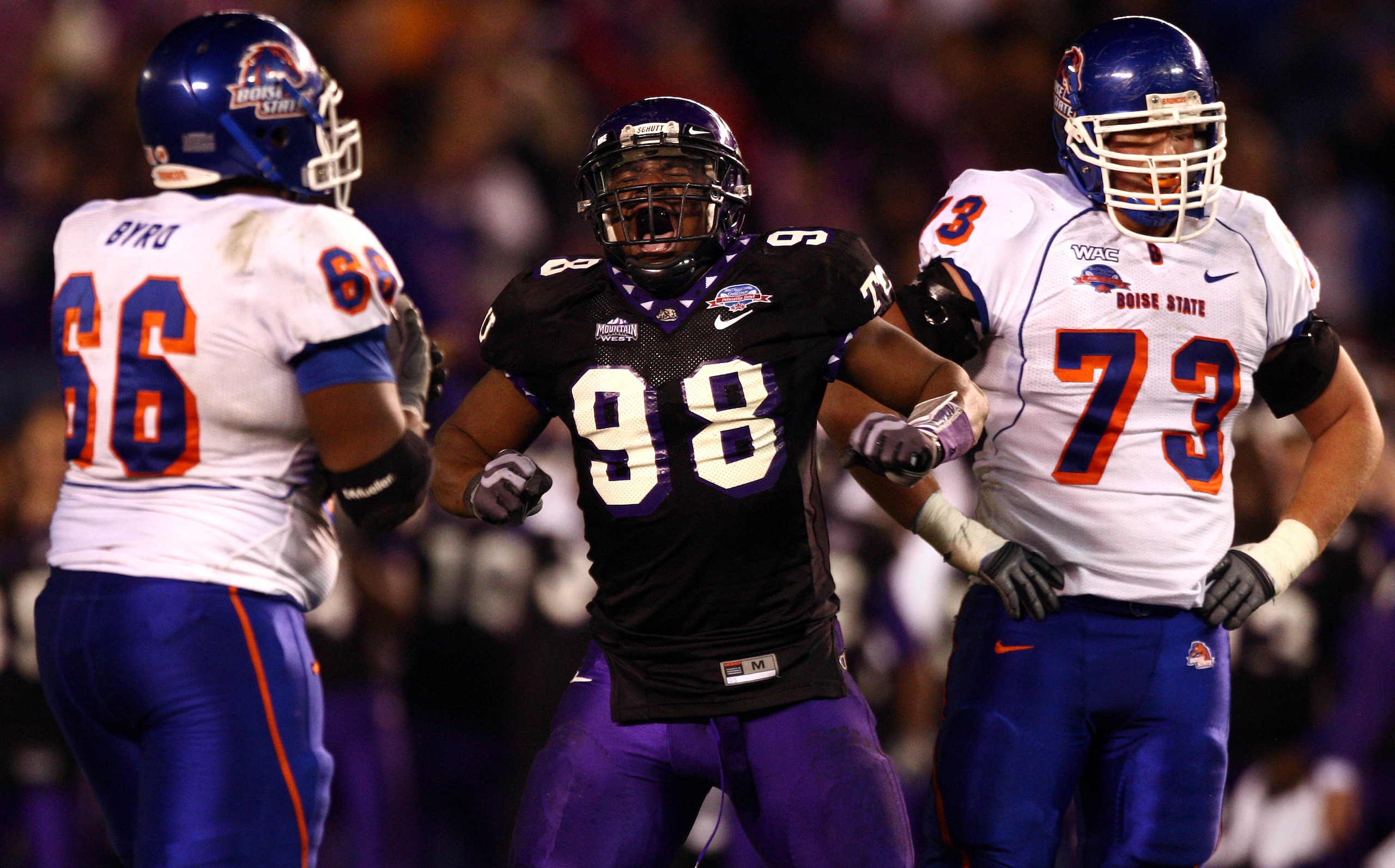 SAN DIEGO, CA - DECEMBER 23:  Defensive End Jerry Hughes #98 of the TCU Horned Frogs celebrates his sack Quarterback Kellen Moore #11 of Boise State Broncos during Frogs' 17-16 win over the Broncos in the San Diego County Credit Union Poinsettia Bowl at Q