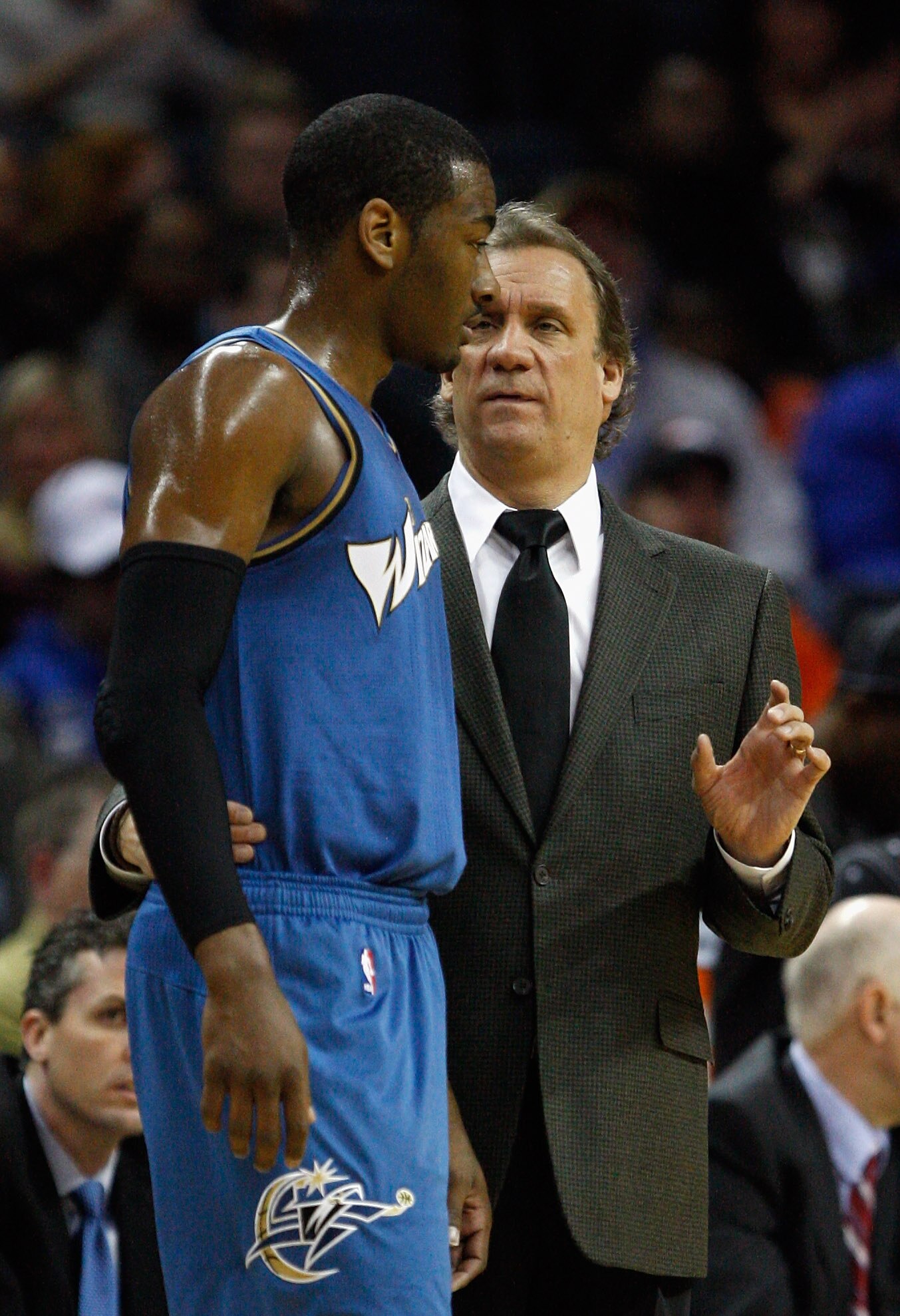 CHARLOTTE, NC - JANUARY 08:  Head coach Flip Saunders and John Wall #2 of the Washington Wizards talk on the sidelines during their game agains the Charlotte Bobcats at Time Warner Cable Arena on January 8, 2011 in Charlotte, North Carolina. NOTE TO USER: