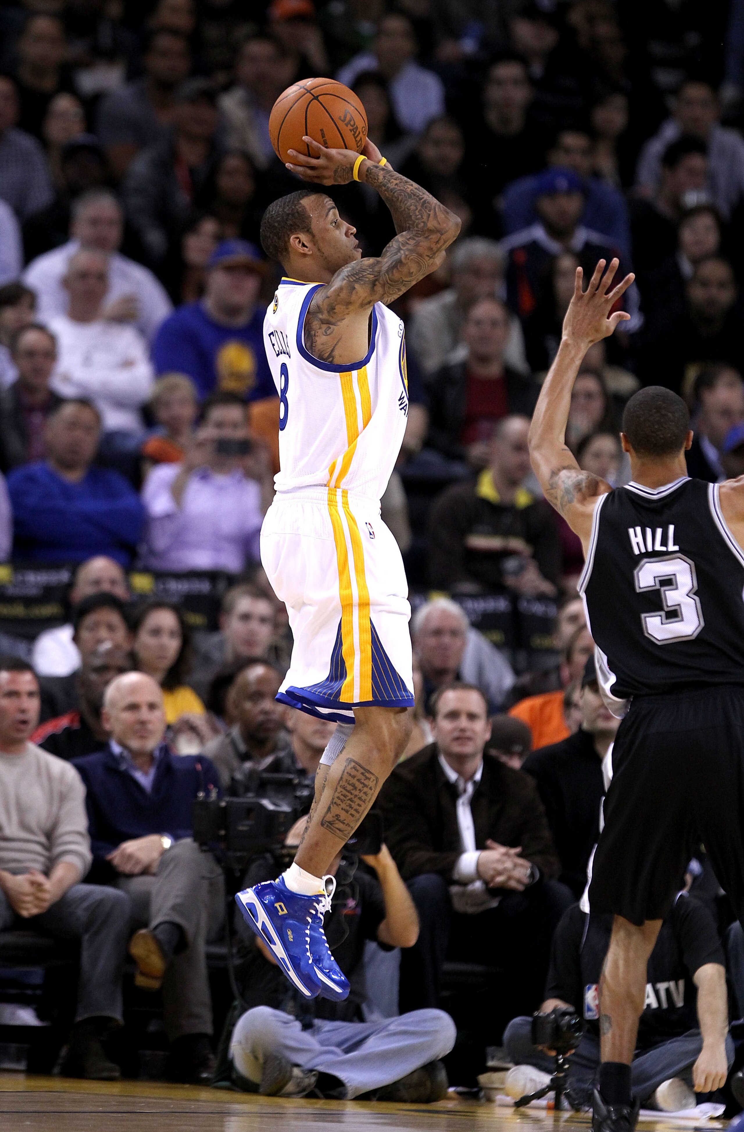 OAKLAND, CA - JANUARY 24:  Monta Ellis #8 of the Golden State Warriors in action against the San Antonio Spurs at Oracle Arena on January 24, 2011 in Oakland, California.  NOTE TO USER: User expressly acknowledges and agrees that, by downloading and or us