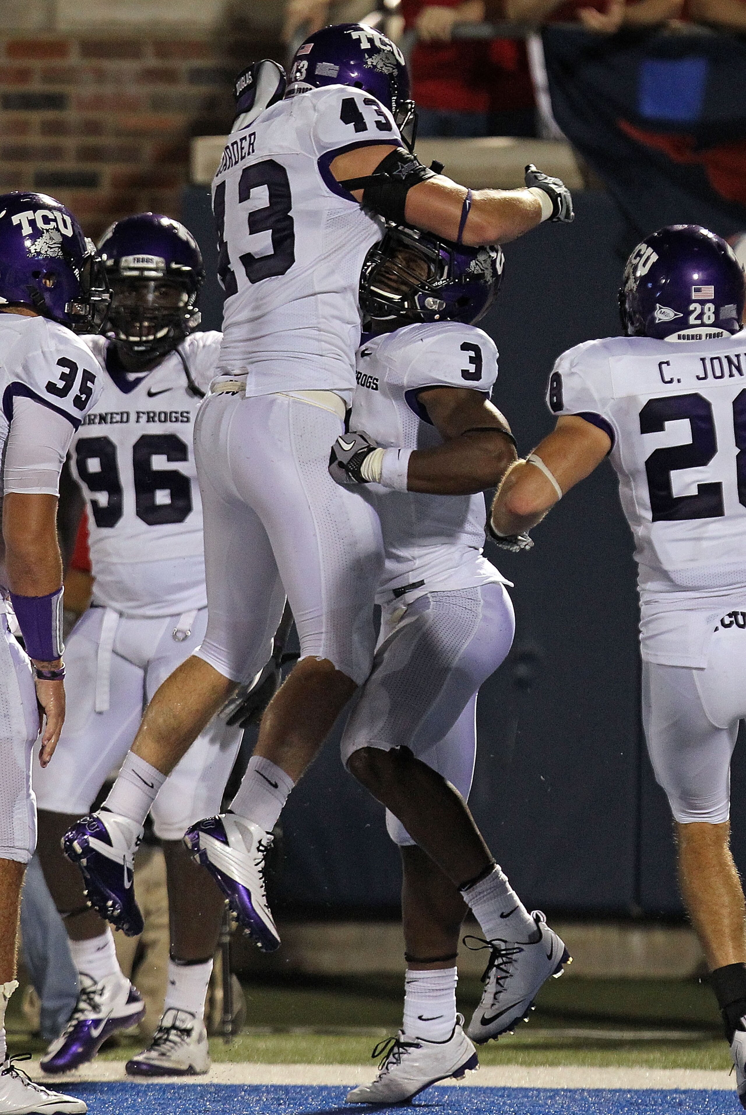 DALLAS - SEPTEMBER 24:  Safety Tejay Johnson #3 of the TCU Horned Frogs celebrates his touchdown pass interception with Tank Carder #43 in the fourth quarter against the SMU Mustangs at Gerald J. Ford Stadium on September 24, 2010 in Dallas, Texas.  (Phot