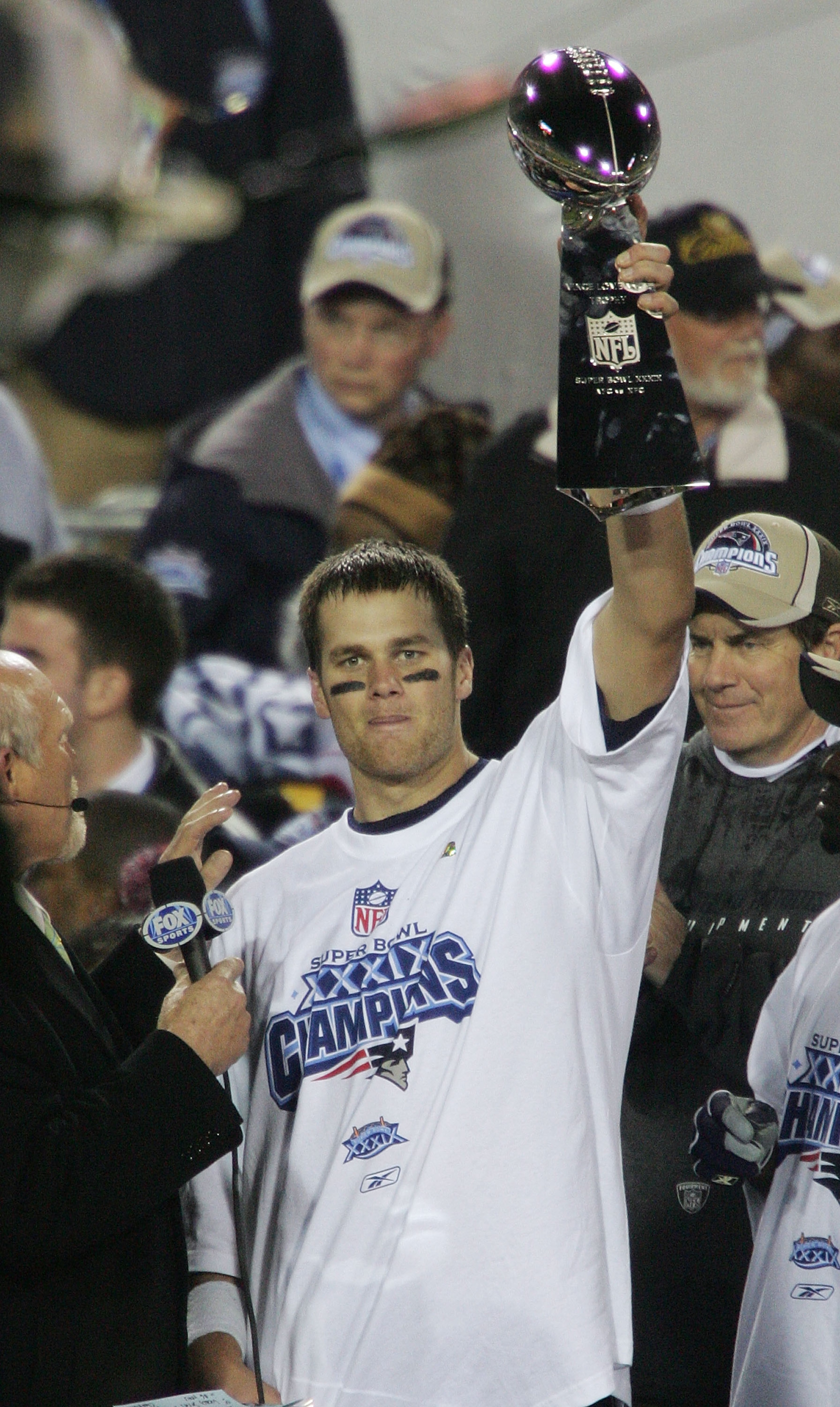 JACKSONVILLE, FLORIDA - FEBRUARY 06:  Quarterback Tom Brady #12 of the New England Patriots celebrates with the Lombardi trophy after defeating the Philadelphia Eagles in Super Bowl XXXIX at Alltel Stadium on February 6, 2005 in Jacksonville, Florida.  Th