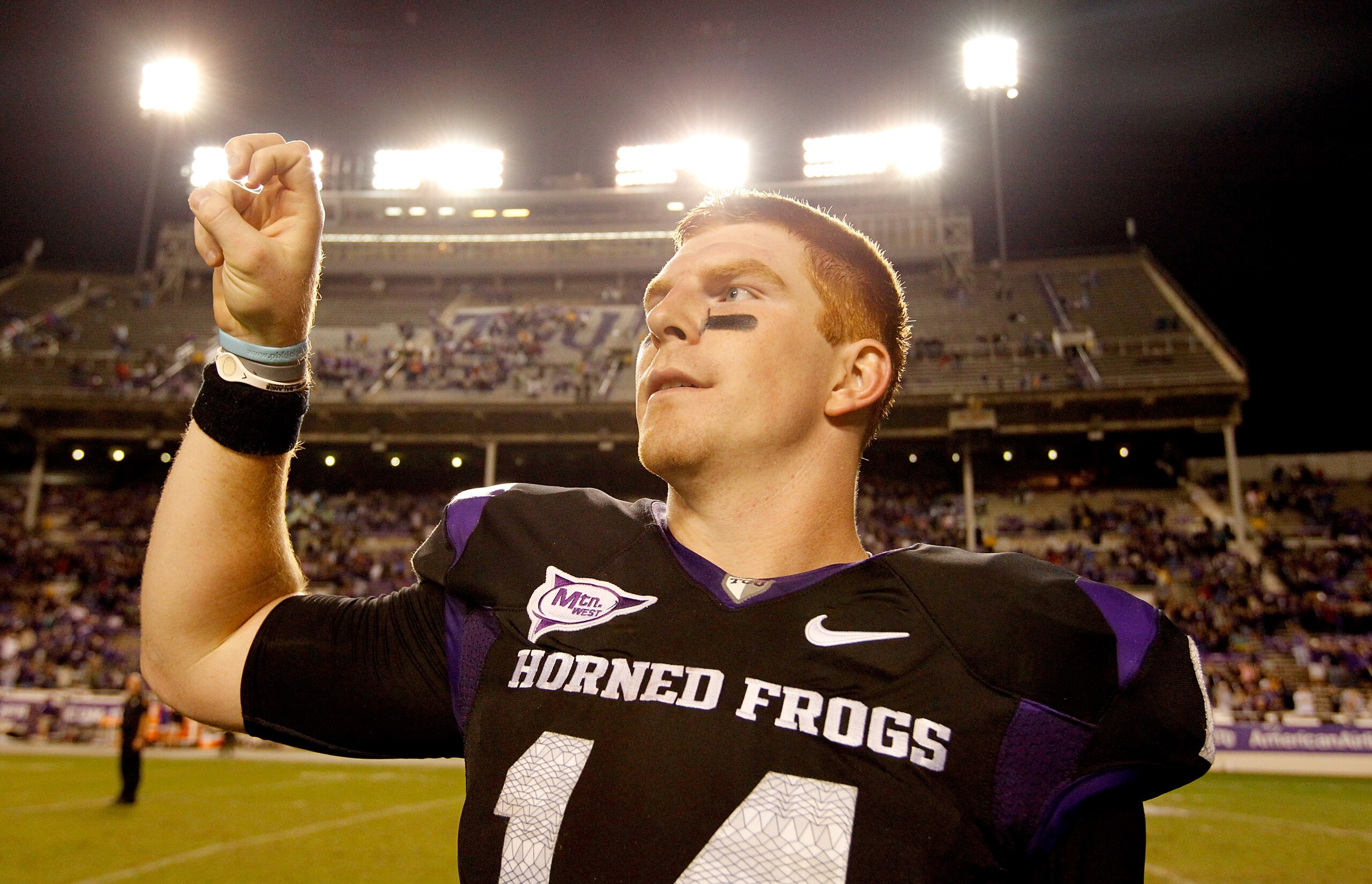 FORT WORTH, TX - OCTOBER 23:  Quarterback Andy Dalton #14 of the TCU Horned Frogs celebrates after TCU beat the Air Force Falcons 38-7 at Amon G. Carter Stadium on October 23, 2010 in Fort Worth, Texas.  (Photo by Tom Pennington/Getty Images)