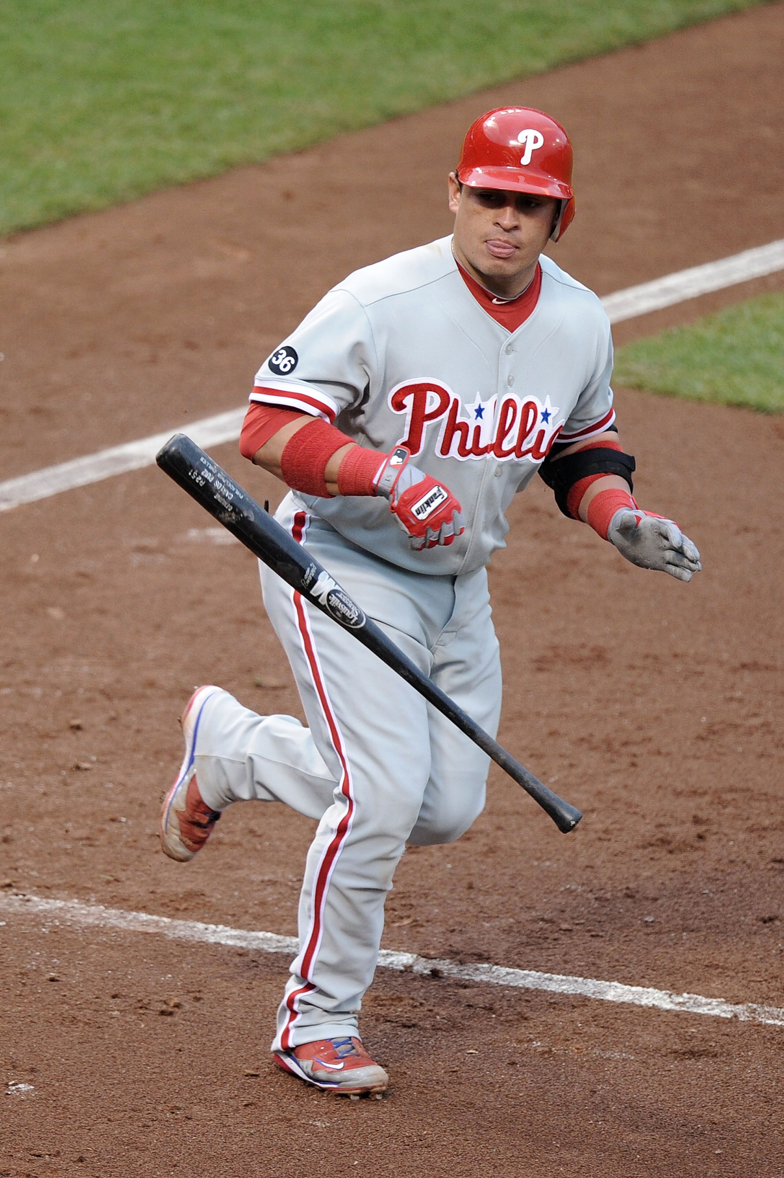 SAN FRANCISCO - OCTOBER 21:  Carlos Ruiz #51 of the Philadelphia Phillies throws his bat after being hit by a Tim Lincecum #55 of the San Francisco Giants pitch in the third inning in Game Five of the NLCS during the 2010 MLB Playoffs at AT&T Park on Octo