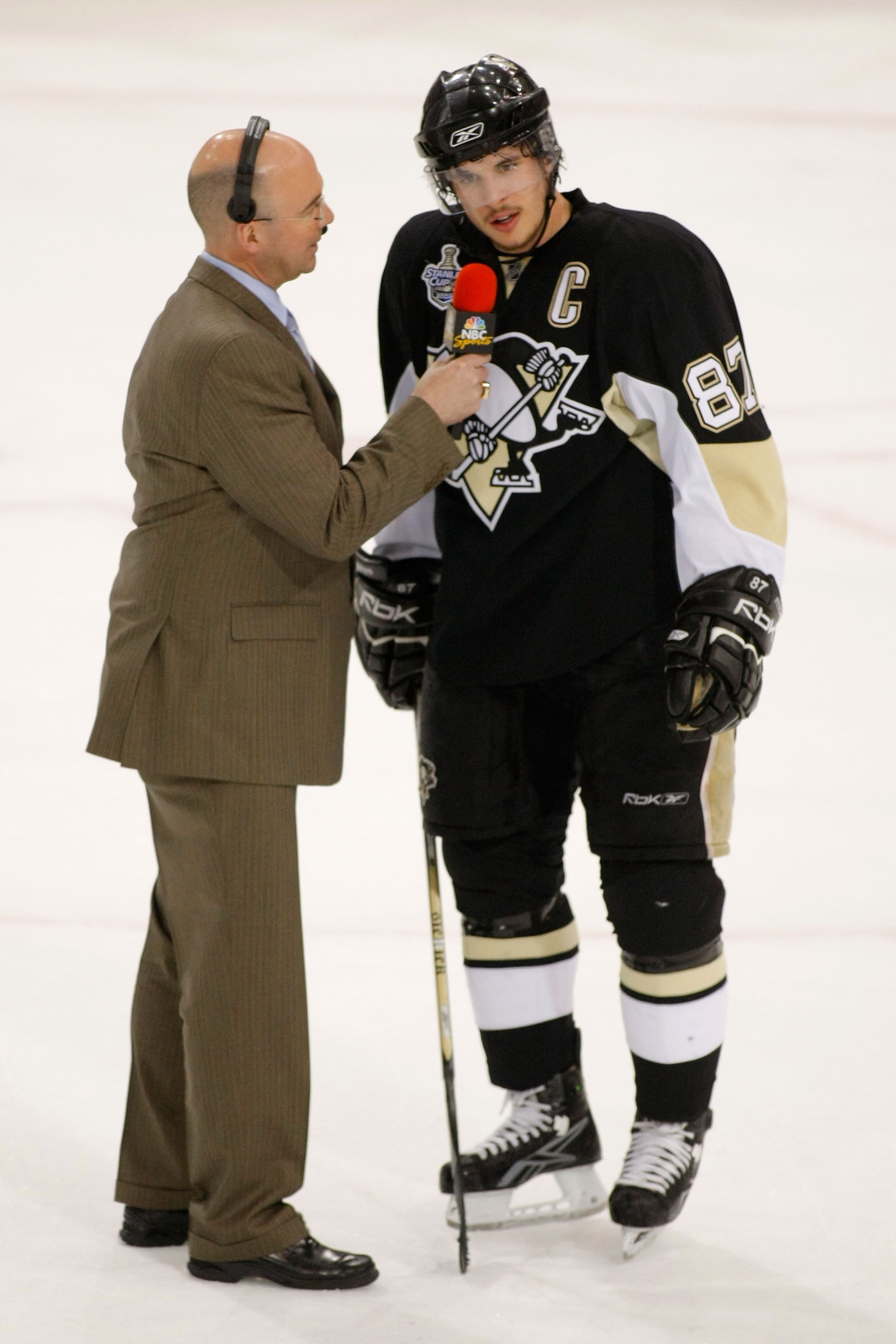 PITTSBURGH - MAY 28:  Hockey analyst Pierre McGuire interviews Sidney Crosby #87 of the Pittsburgh Penguins during after the first period of game three of the 2008 NHL Stanley Cup Finals against the Detroit Red Wings at Mellon Arena on May 28, 2008 in Pit