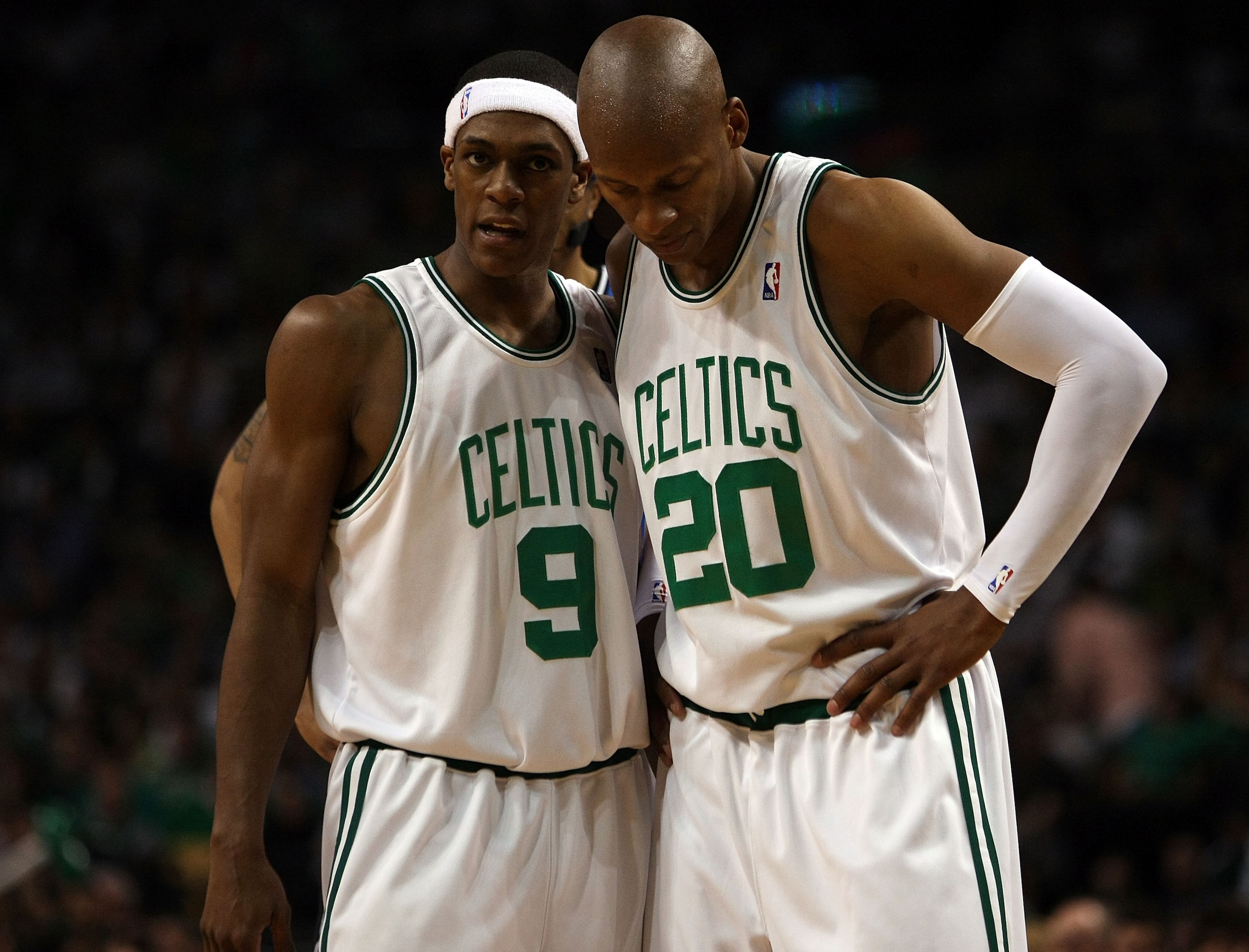 BOSTON - MAY 17:  Rajon Rondo #9 and Ray Allen #20 of the Boston Celtics talk as the Orlando Magic shoot a free throw in Game Seven of the Eastern Conference Semifinals during the 2009 NBA Playoffs at TD Banknorth Garden on May 17, 2009 in Boston, Massach