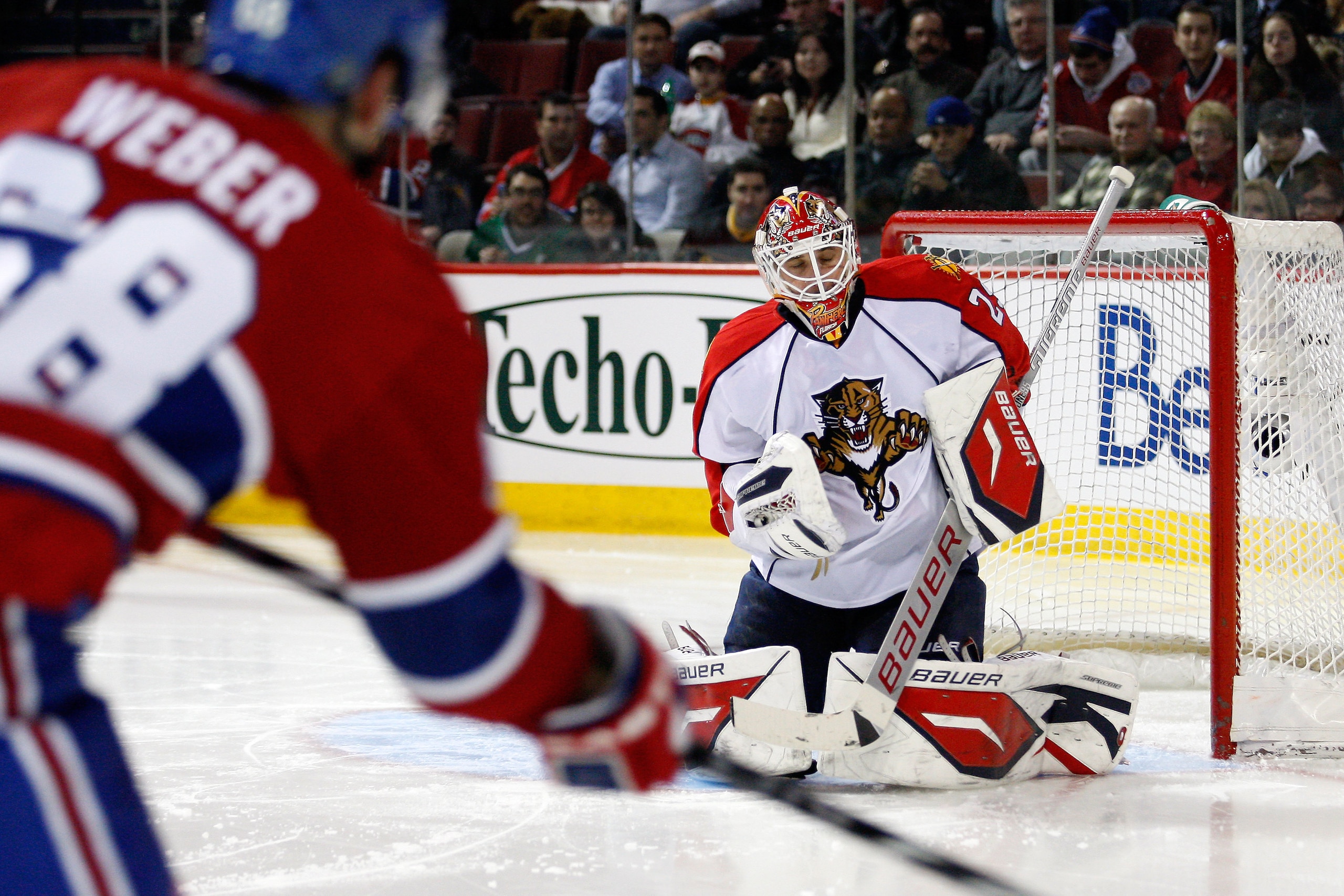 MONTREAL, CANADA - FEBRUARY 2:  Tomas Vokoun #29 of the Florida Panthers stops the puck on a shot by Yannick Weber #68 of the Montreal Canadiens during the NHL game at the Bell Centre on February 2, 2011 in Montreal, Quebec, Canada.  (Photo by Richard Wol