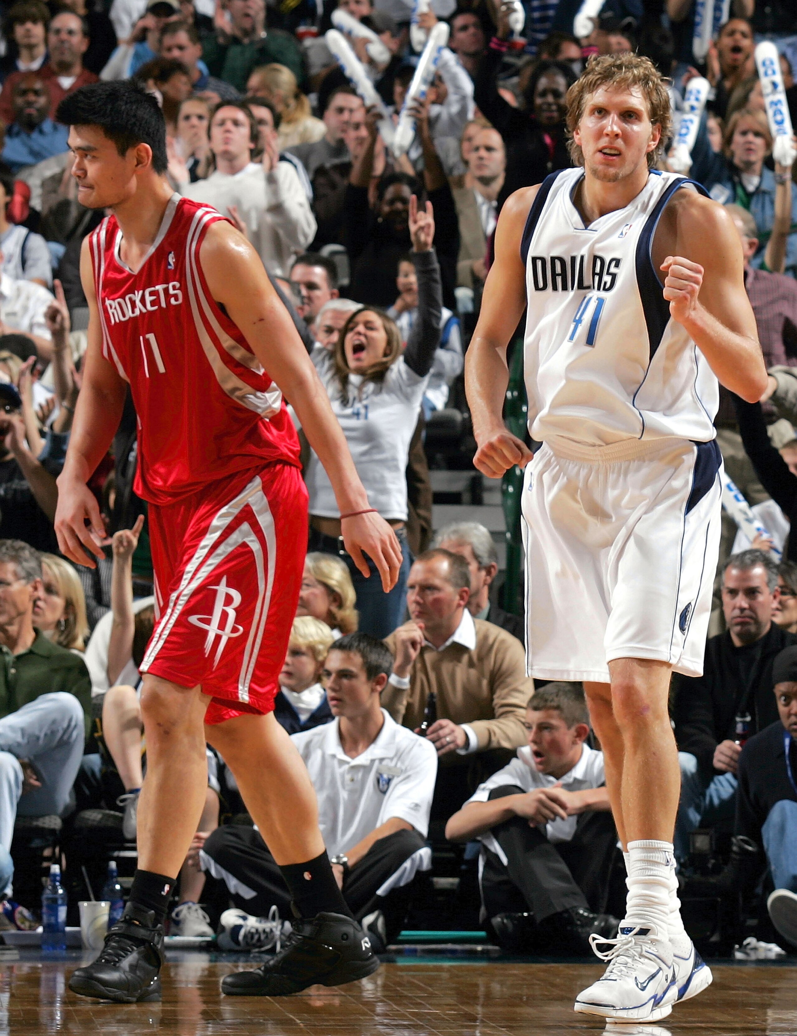 DALLAS - NOVEMBER 22:  Forward Dirk Nowitzki #41 of the Dallas Mavericks reacts in front of Yao Ming #11 of the Houston Rockets on November 22, 2005 at the American Airlines Center in Dallas, Texas.  NOTE TO USER: User expressly acknowledges and agrees th