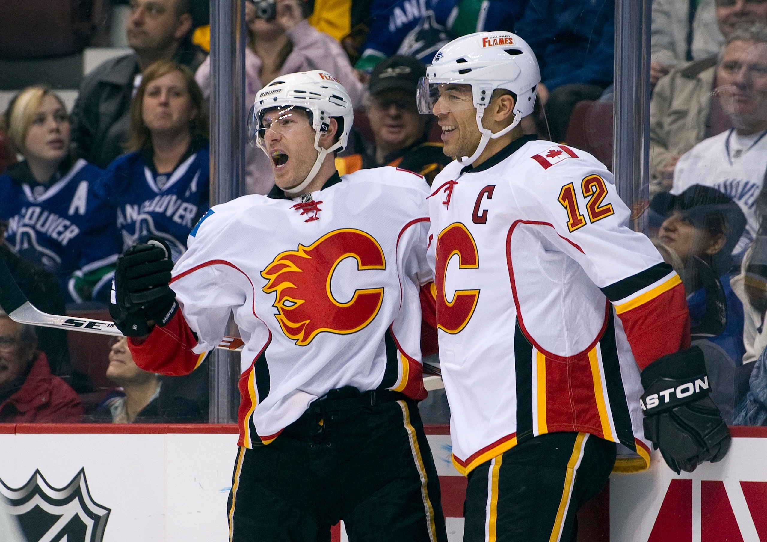 VANCOUVER, CANADA - JANUARY 22: Brendan Morrison #8 of the Calgary Flames celebrates with teammate Jarome Iginla #12 after scoring against the Vancouver Canucks during the first period in NHL action on January 22, 2011 at Rogers Arena in Vancouver, Britis
