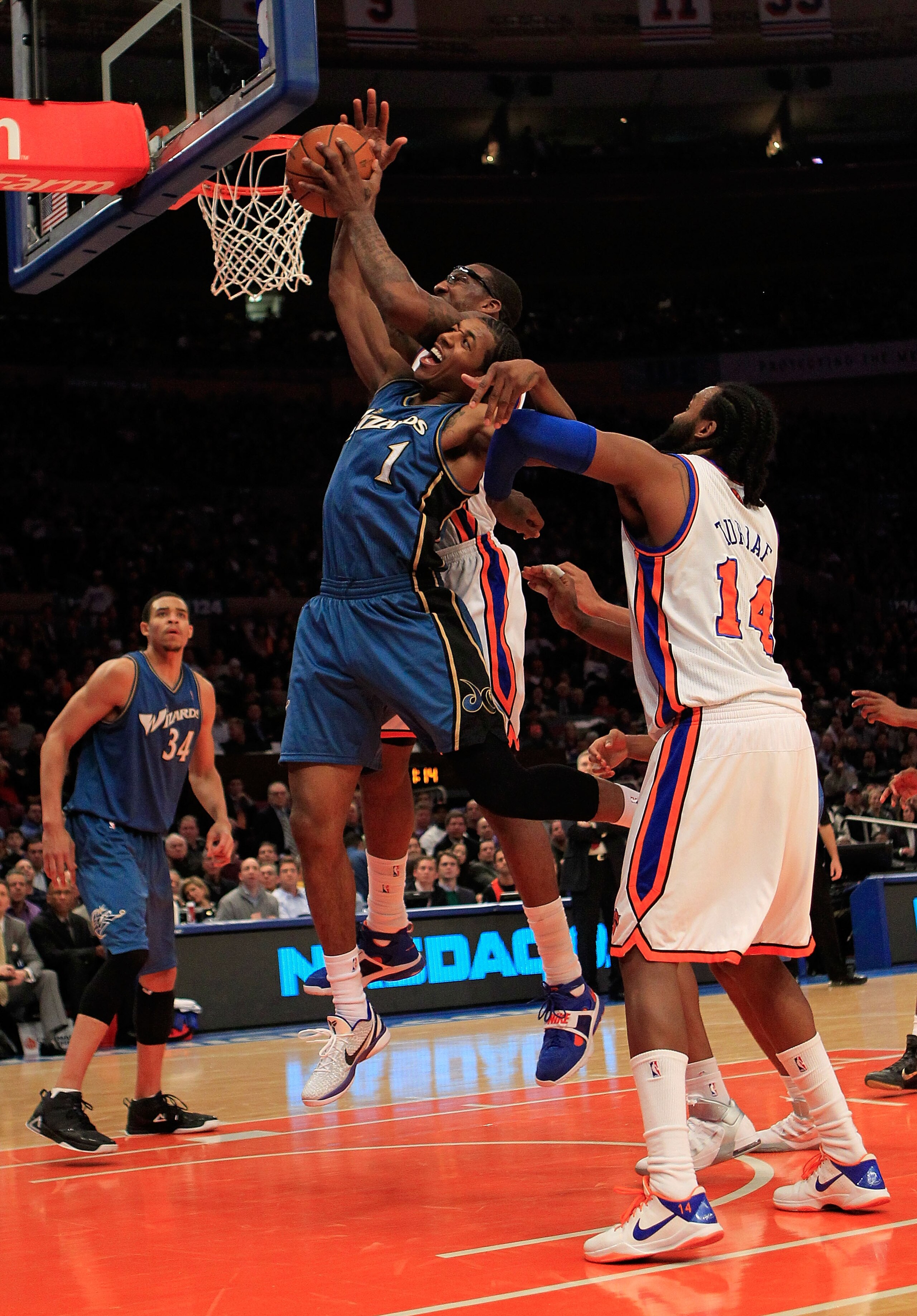 NEW YORK, NY - JANUARY 24: Amar'e Stoudemire #1 of the New York Knicks competes for a rebound against Nick Young #1 of the Washington Wizards at Madison Square Garden on January 24, 2011 in New York City. NOTE TO USER: User expressly acknowledges and agre
