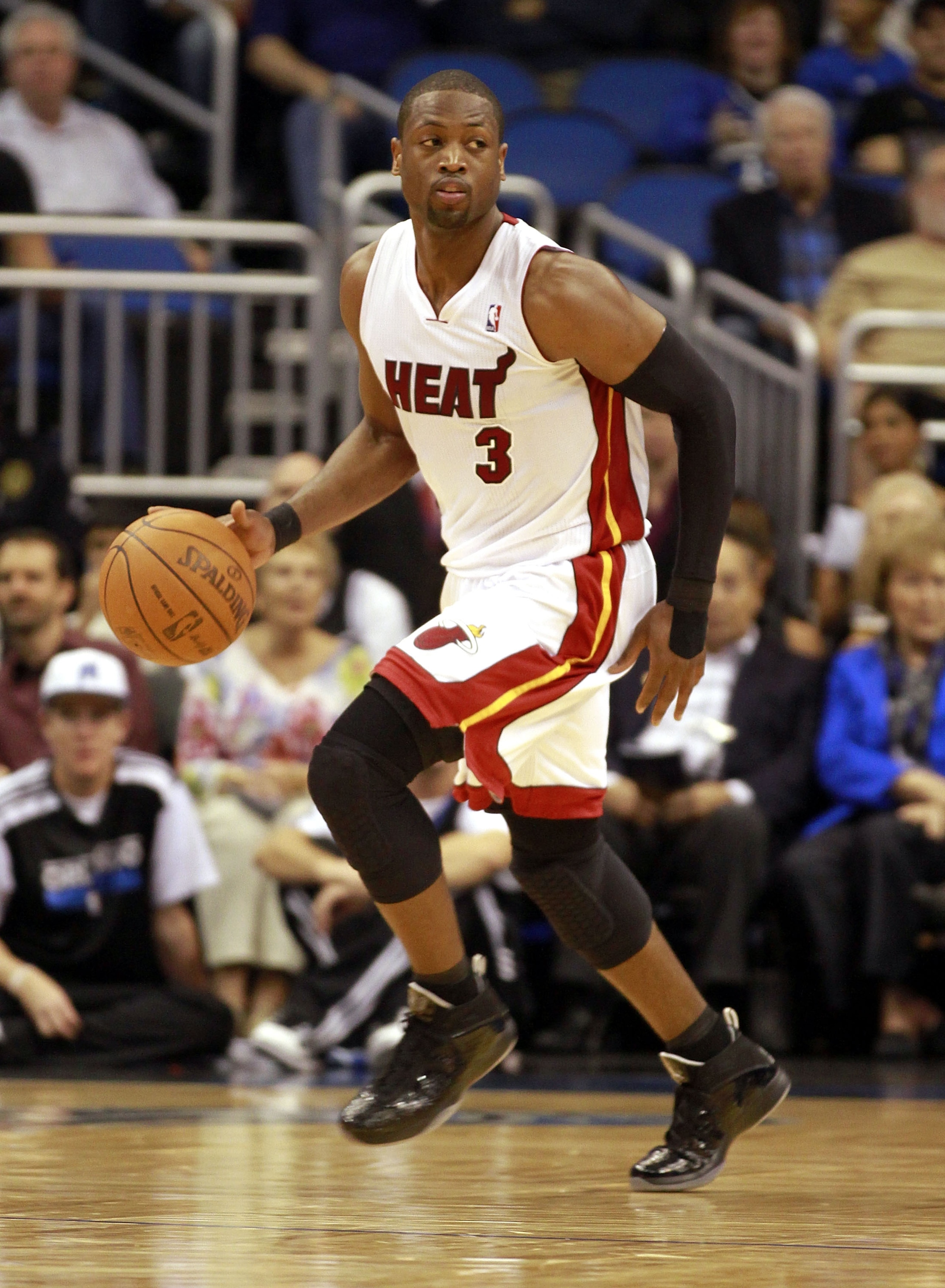 ORLANDO, FL - FEBRUARY 03:  Guard Dwyane Wade #3 of the Miami Heat drives against the Orlando Magic at Amway Arena on February 3, 2011 in Orlando, Florida. NOTE TO USER: User expressly acknowledges and agrees that, by downloading and or using this photogr