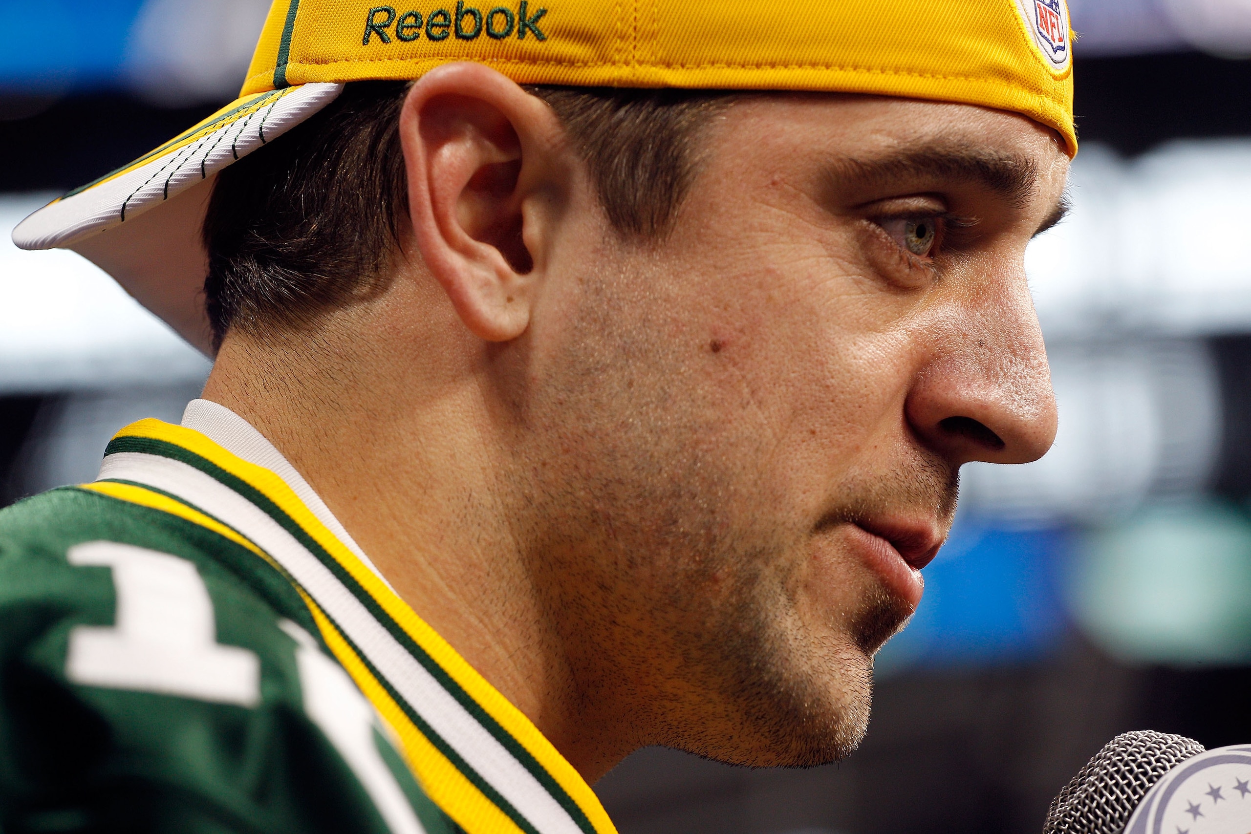 ARLINGTON, TX - FEBRUARY 01:  Quarterback Aaron Rodgers #12 of the Green Bay Packers speaks during Super Bowl XLV Media Day ahead of Super Bowl XLV at Cowboys Stadium on February 1, 2011 in Arlington, Texas. The Pittsburgh Steelers will play the Green Bay
