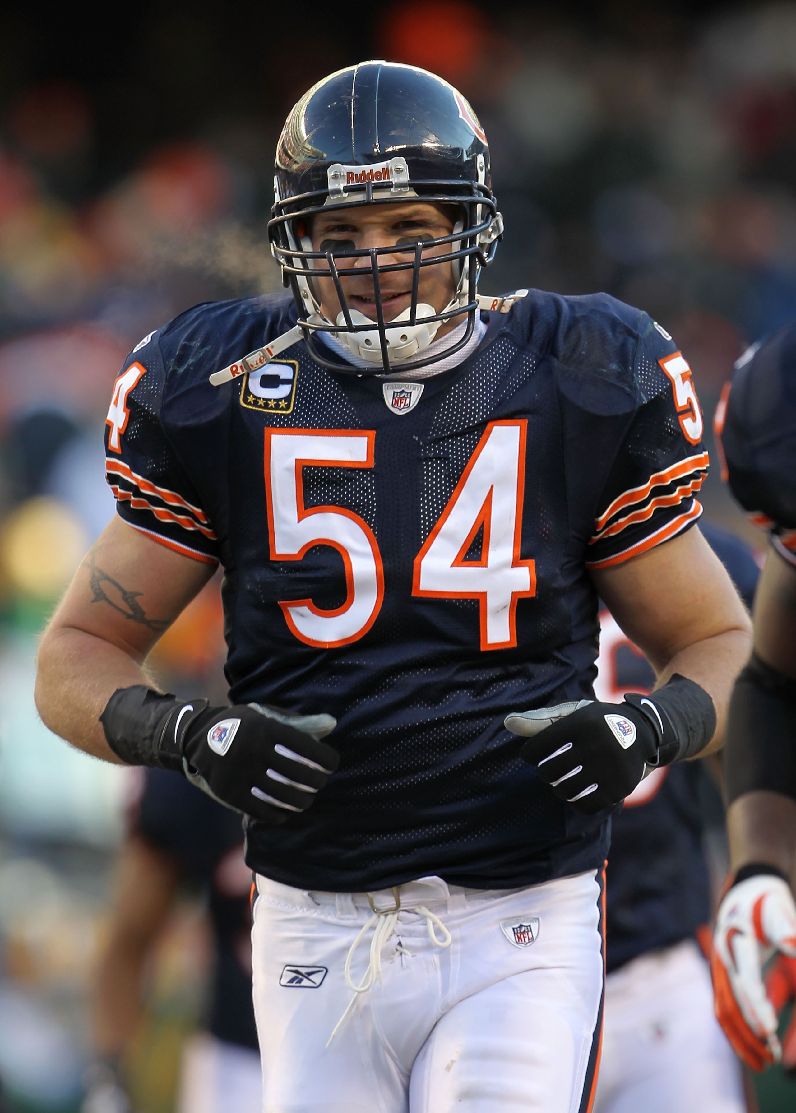 CHICAGO, IL - JANUARY 23: Brian Urlacher #54 of the Chicago Bears smiles while taking on the Green Bay Packers in the NFC Championship Game at Soldier Field on January 23, 2011 in Chicago, Illinois. (Photo by Jamie Squire/Getty Images) CHICAGO, IL - JANUARY 23: Brian Urlacher #54 of the Chicago Bears smiles while taking on the Green Bay Packers in the NFC Championship Game at Soldier Field on January 23, 2011 in Chicago, Illinois. (Photo by Jamie Squire/Getty Images)