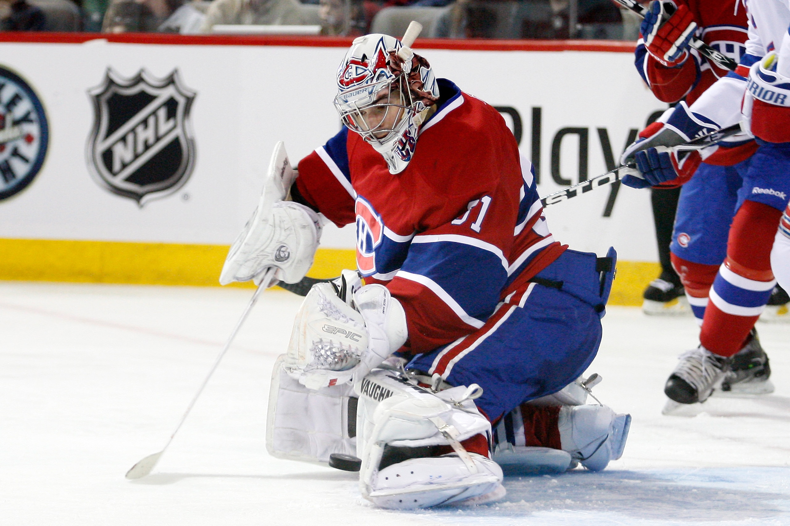 MONTREAL, CANADA - FEBRUARY 5:  Carey Price #31 of the Montreal Canadiens makes a pad save on the puck during the NHL game against the New York Rangers at the Bell Centre on February 5, 2011 in Montreal, Quebec, Canada.  The Canadiens defeated the Rangers