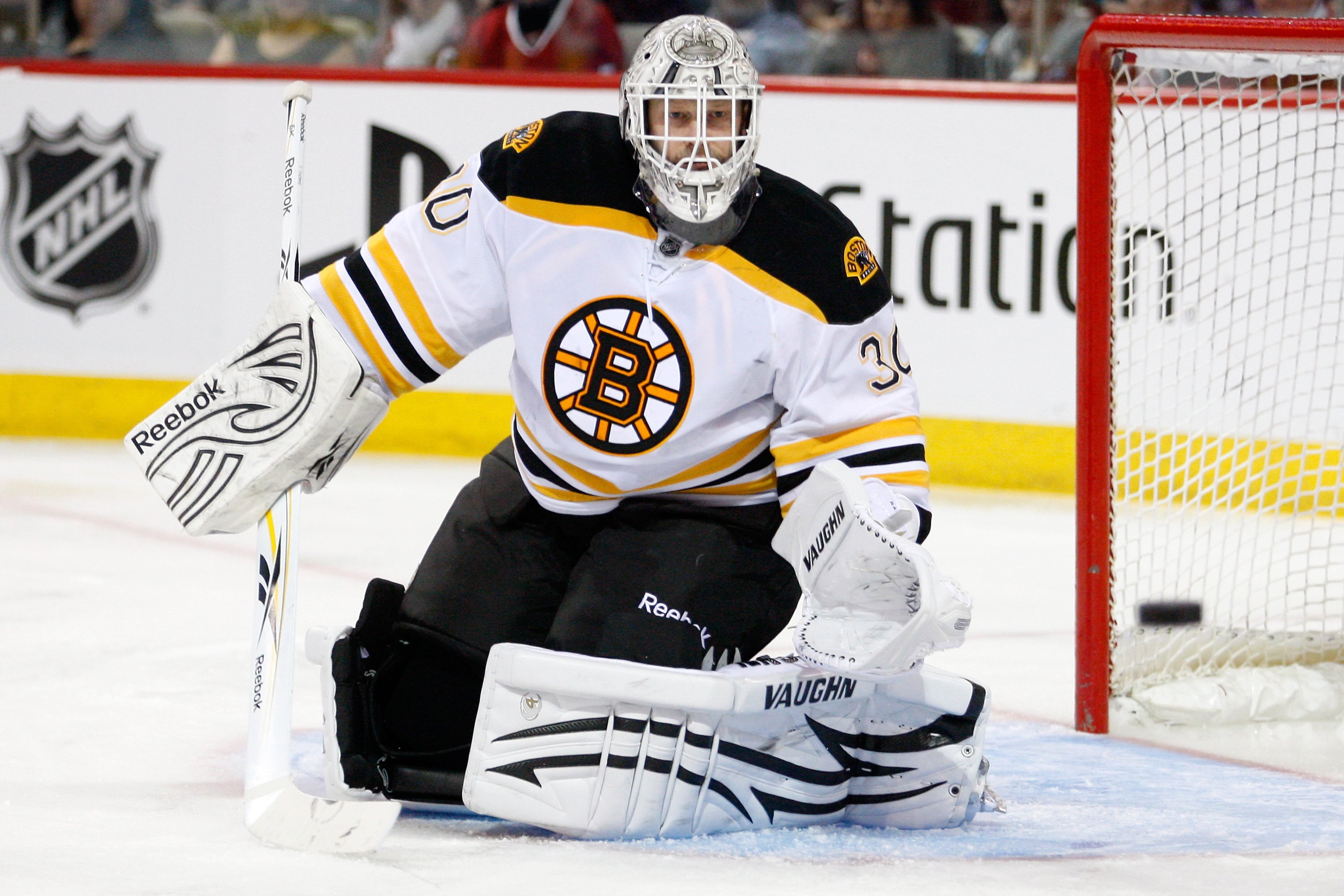 MONTREAL, CANADA - JANUARY 8:  Tim Thomas #30 of the Boston Bruins watches the rebounding puck during the NHL game against the Montreal Canadiens at the Bell Centre on January 8, 2011 in Montreal, Quebec, Canada.  The Canadiens defeated the Bruins 3-2 in
