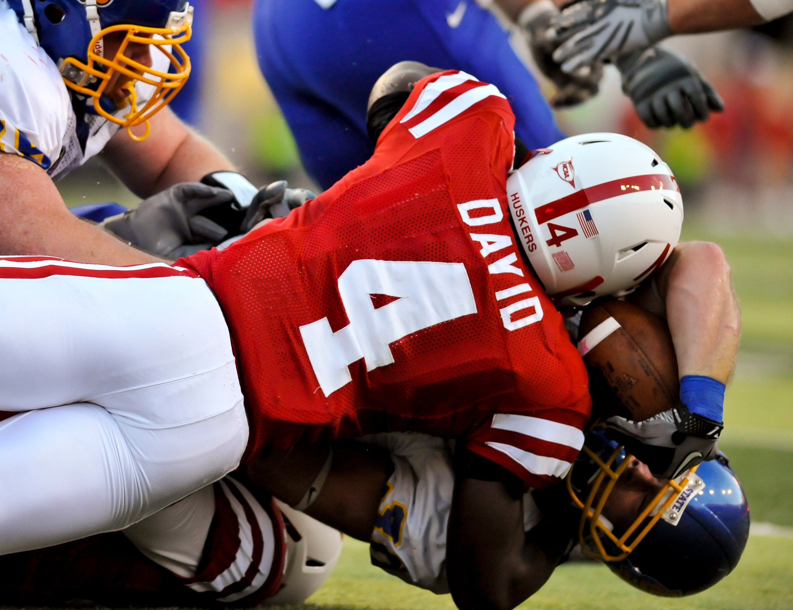 LINCOLN, NEBRASKA - SEPTEMBER 25: Nebraska Cornhuskers linebacker Lavonte David #4 tackles South Dakota State Jackrabbits running back Kyle Minett #30 during first half action of their game at Memorial Stadium on September 25, 2010 in Lincoln, Nebraska. N