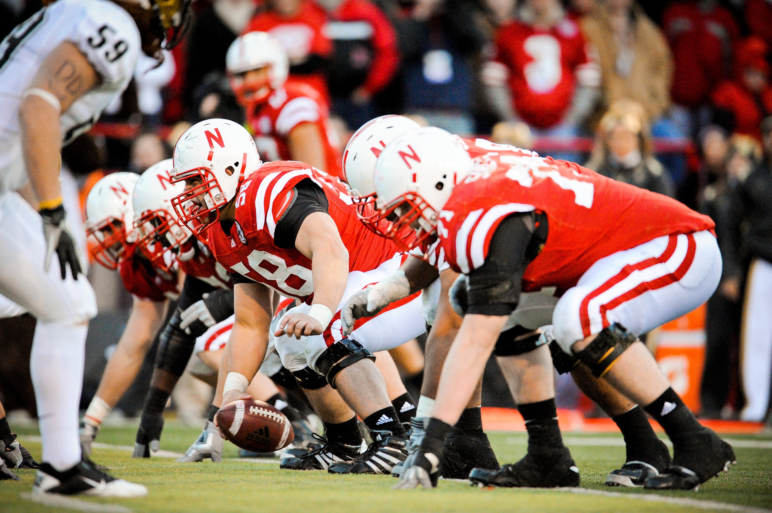 LINCOLN, NE - NOVEMBER 26: Mike Caputo #58 of the Nebraska Cornhuskers and the rest of the Nebraska offensive line powered their way past the Colorado Buffaloes during their game at Memorial Stadium on November 26, 2010 in Lincoln, Nebraska. Nebraska defe