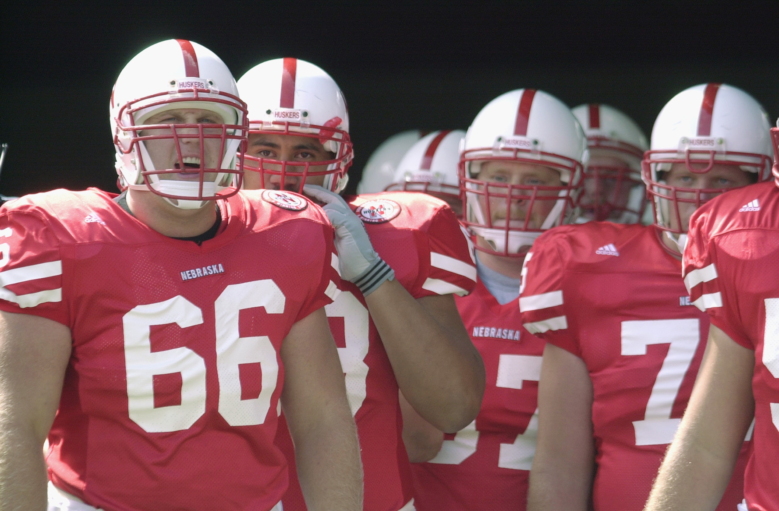 LINCOLN, NEBRASKA - AUGUST 25:  Offensive lineman Jon Rutherford #66 of the Nebraska Cornhuskers stands with his teammates before the NCAA football game against the Texas Christian University Horned Frogs on August 25, 2001 at Municipal Stadium in Lincoln