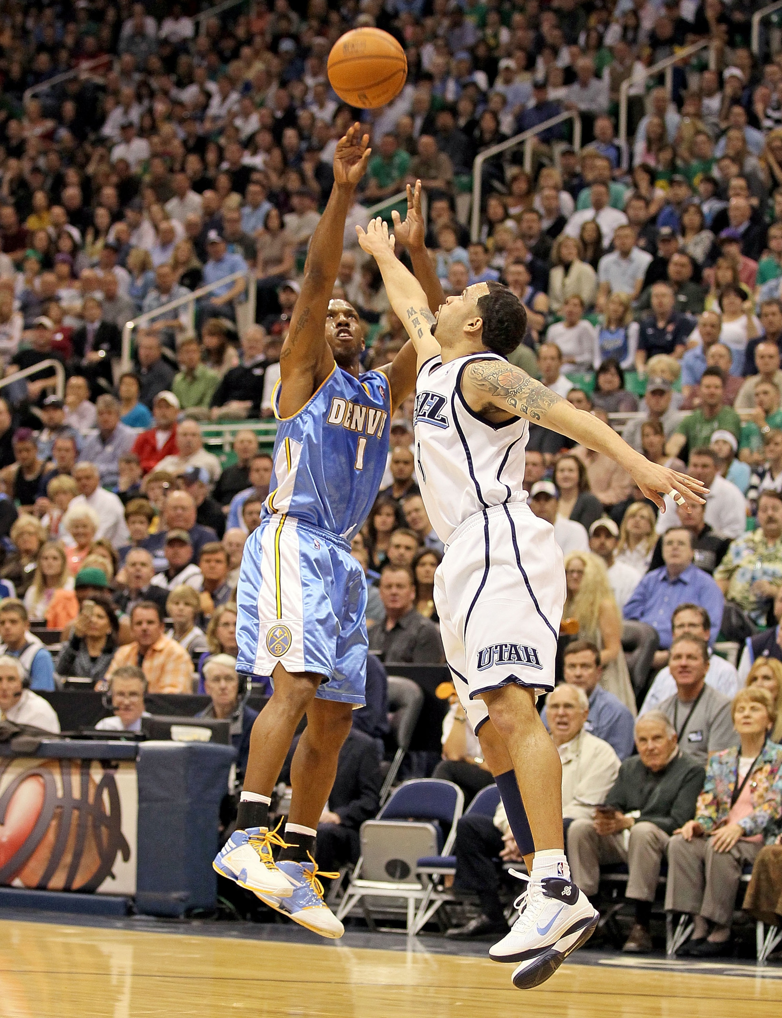 SALT LAKE CITY - APRIL 23: Chauncey Billups #1 of the Denver Nuggets shoots the ball while defended by Deron Williams #8 of the Utah Jazz during Game 3 of the Western Conference Quarterfinals of the 2010 NBA Playoffs at EnergySolutions Arena on April 23 SALT LAKE CITY - APRIL 23: Chauncey Billups #1 of the Denver Nuggets shoots the ball while defended by Deron Williams #8 of the Utah Jazz during Game 3 of the Western Conference Quarterfinals of the 2010 NBA Playoffs at EnergySolutions Arena on April 23
