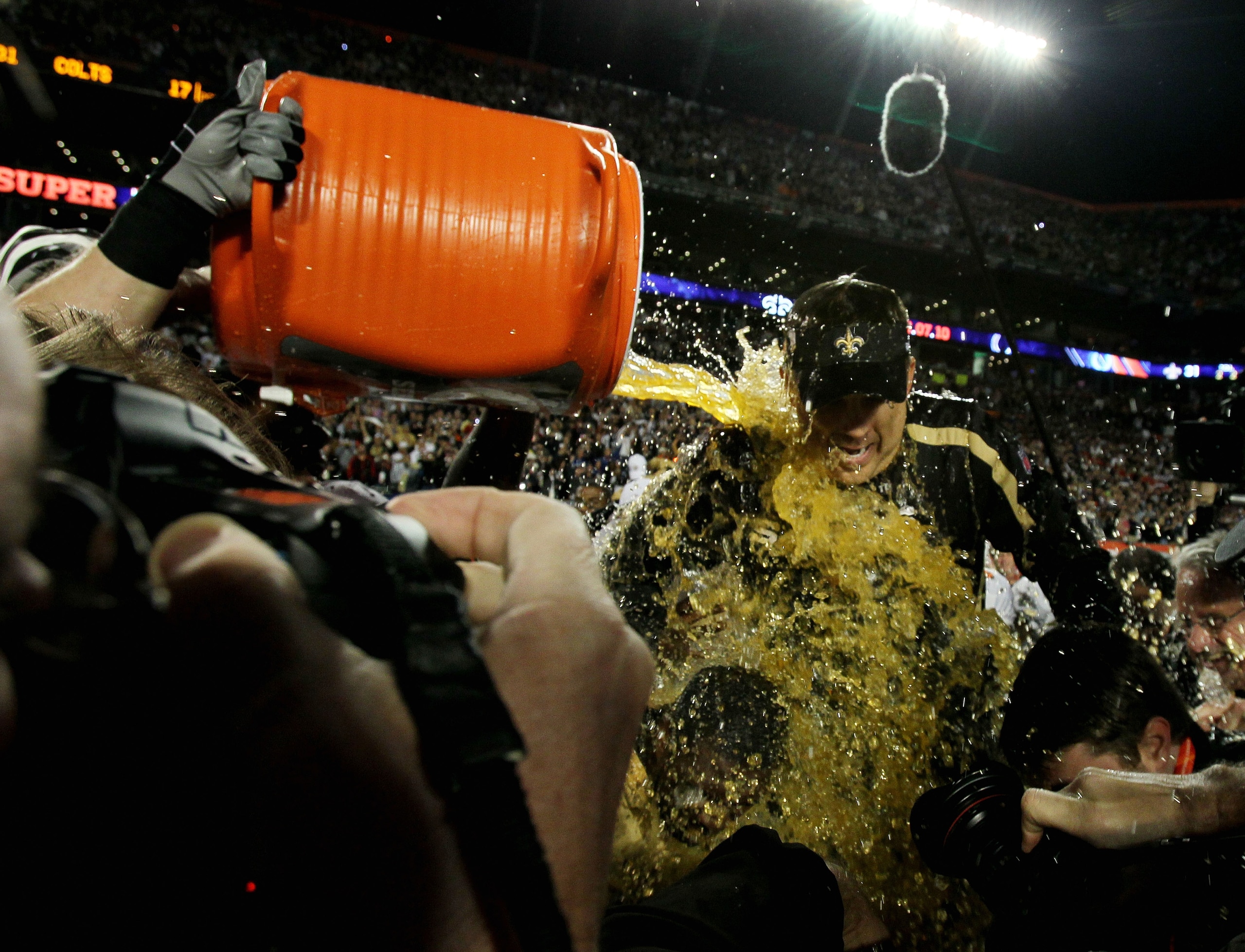 MIAMI GARDENS, FL - FEBRUARY 07: Head coach Sean Payton of the New Orleans Saints gets Gatorade dumped on him after defeating the Indianapolis Colts during Super Bowl XLIV on February 7, 2010 at Sun Life Stadium in Miami Gardens, Florida.  (Photo by Andy