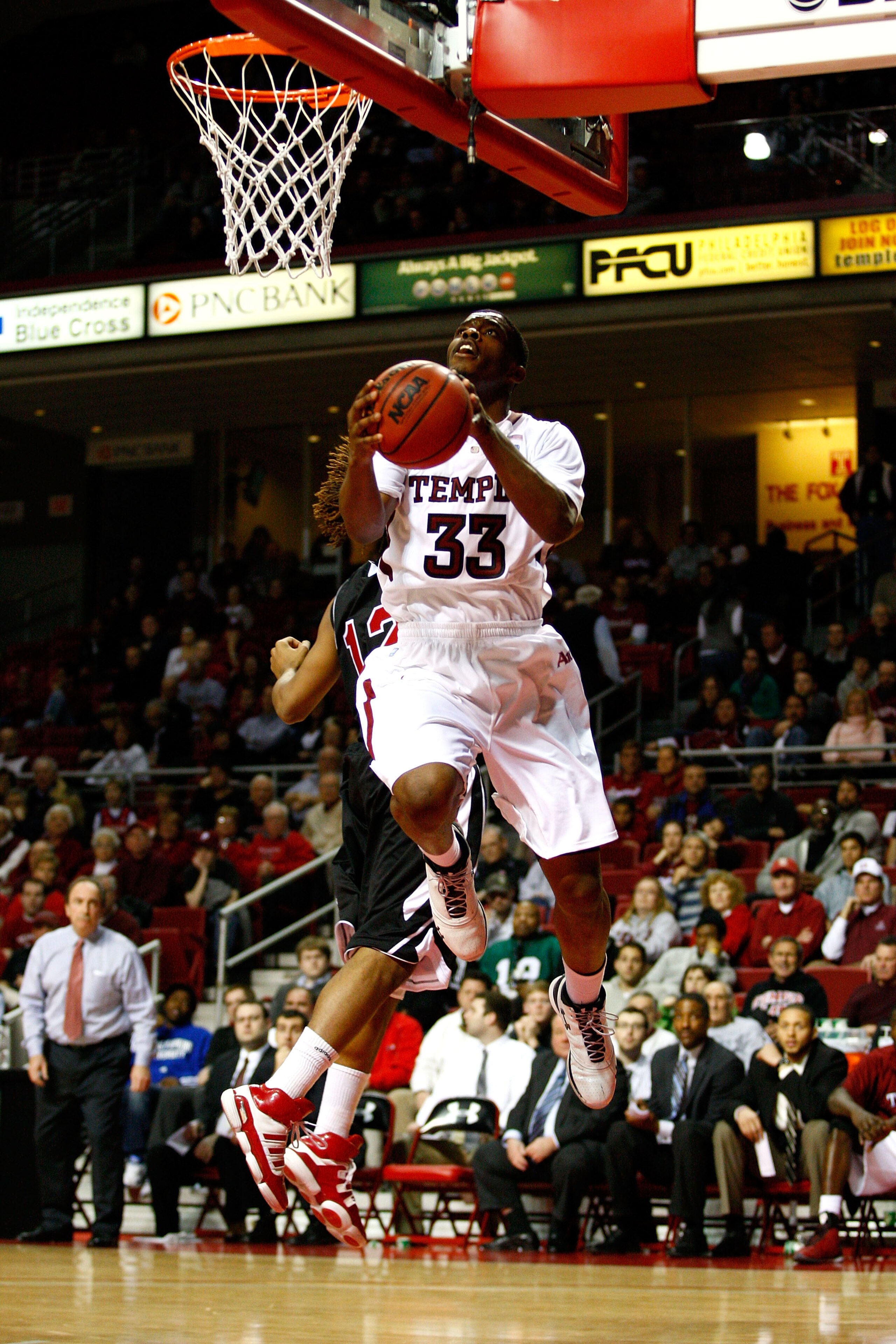 PHILADELPHIA, PA - DECEMBER 18:  Scootie Randall #33 of the Temple Owls drives for a shot attempt in the second half against the Northern Illinois Huskies at the Liacouras Center on December 18, 2010 in Philadelphia, Pennsylvania.  (Photo by Chris Chamber