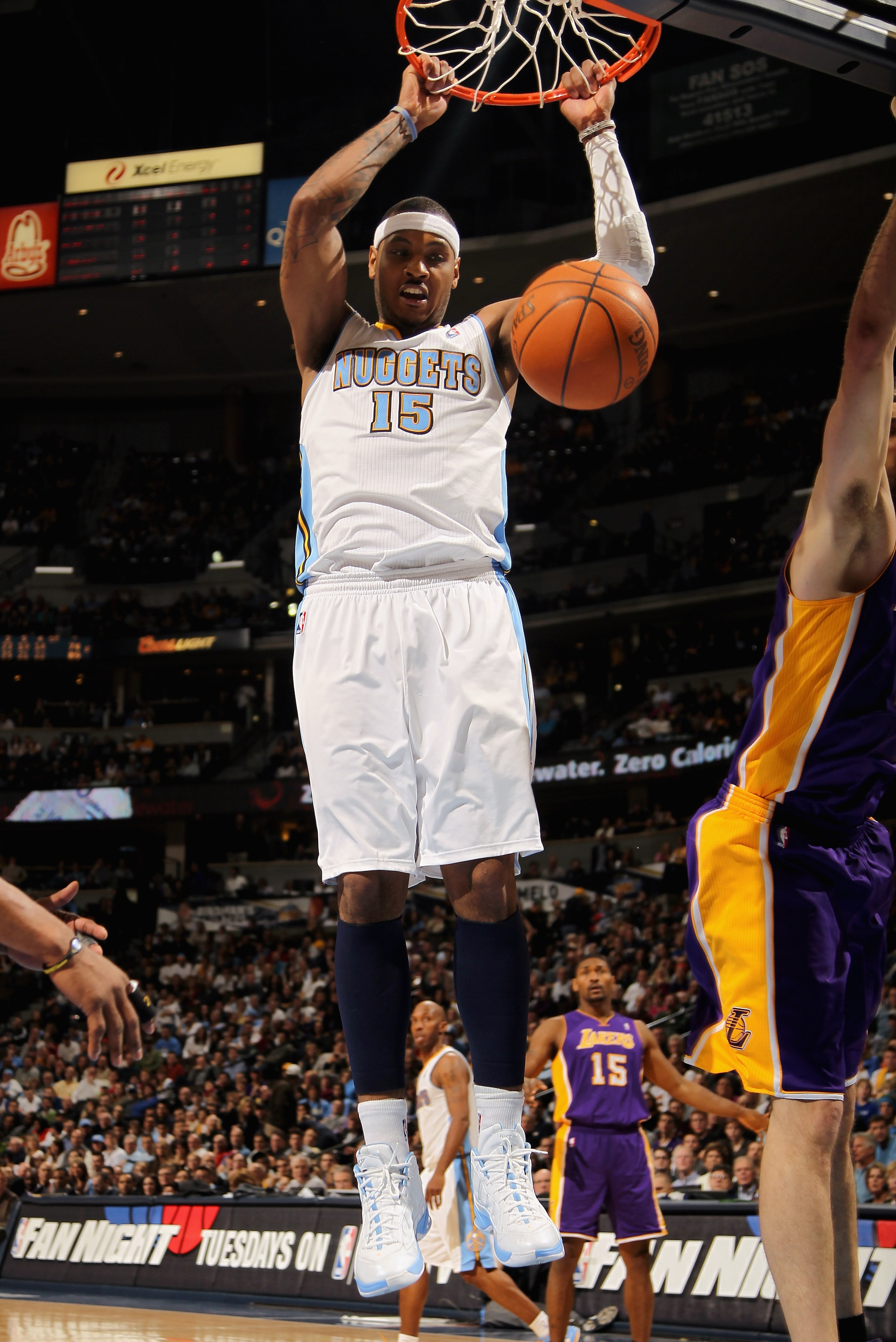 DENVER, CO - JANUARY 21: Carmelo Anthony #15 of the Denver Nuggets dunks the ball against the Los Angeles Lakers at the Pepsi Center on January 21, 2011 in Denver, Colorado. The Lakers defeated the Nuggets 107-97. NOTE TO USER: User expressly acknowledge DENVER, CO - JANUARY 21: Carmelo Anthony #15 of the Denver Nuggets dunks the ball against the Los Angeles Lakers at the Pepsi Center on January 21, 2011 in Denver, Colorado. The Lakers defeated the Nuggets 107-97. NOTE TO USER: User expressly acknowledge
