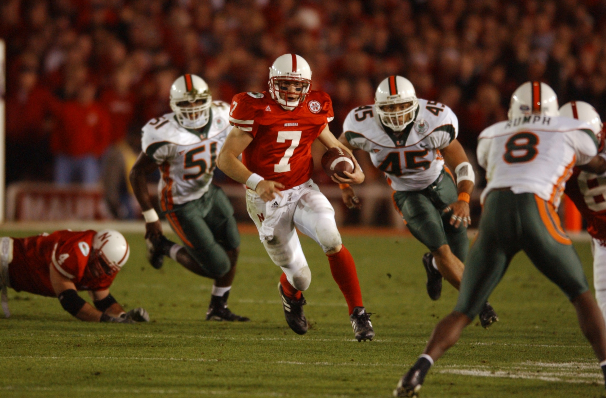 3 Jan 2002:  Quarterback Eric Crouch #7 of Nebraska scrambles against the defense of Howard Clark #45 and Jonathan Vilna #51 of Miami during the Rose Bowl National Championship game at the Rose Bowl in Pasadena, California.  Miami won the game 37-14, winn