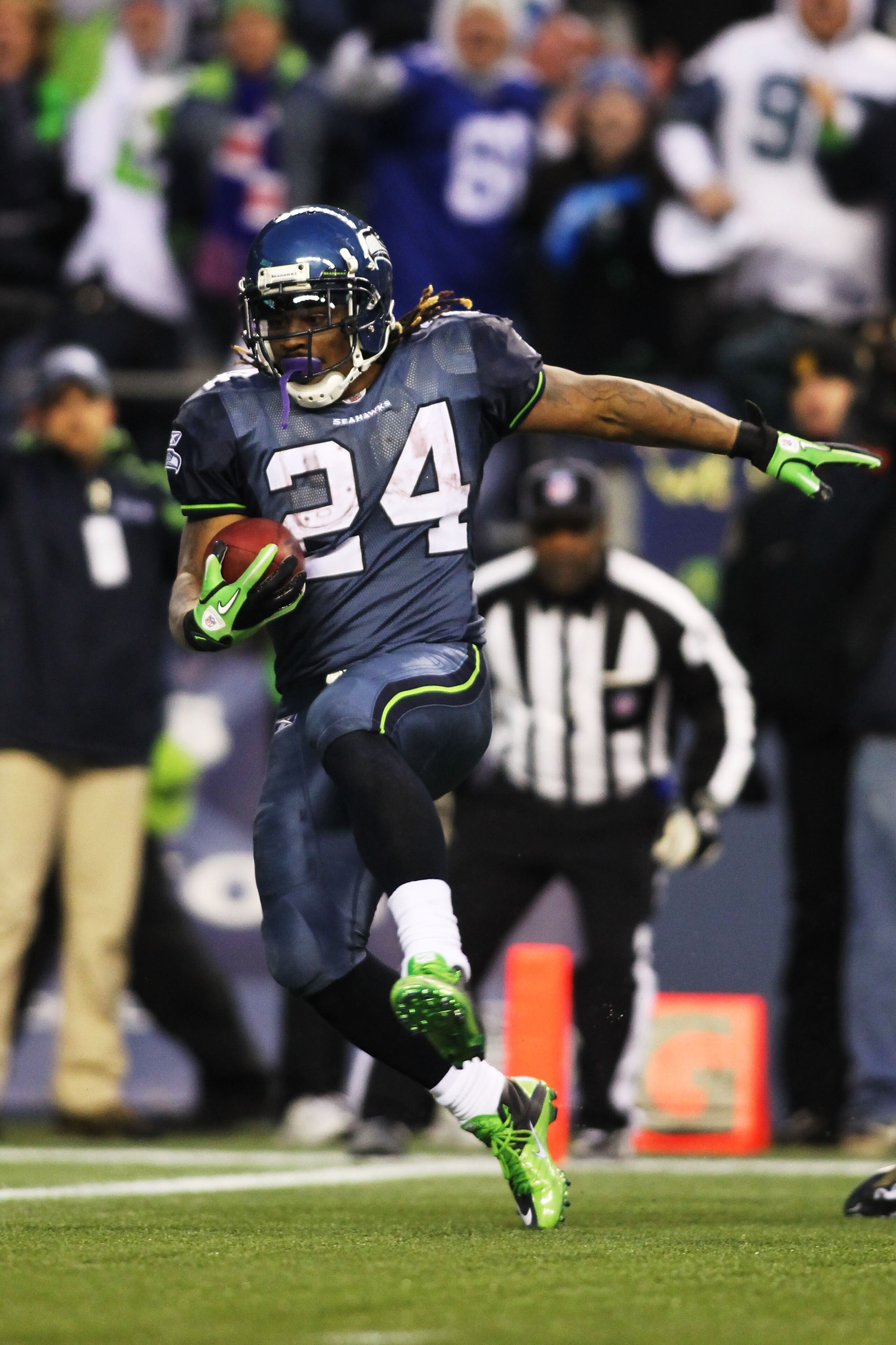 SEATTLE, WA - JANUARY 08:  Running back Marshawn Lynch #24 of the Seattle Seahawks runs for a 67-yard touchdown run in the fourth quarter against the New Orleans Saints during the 2011 NFC wild-card playoff game at Qwest Field on January 8, 2011 in Seattl